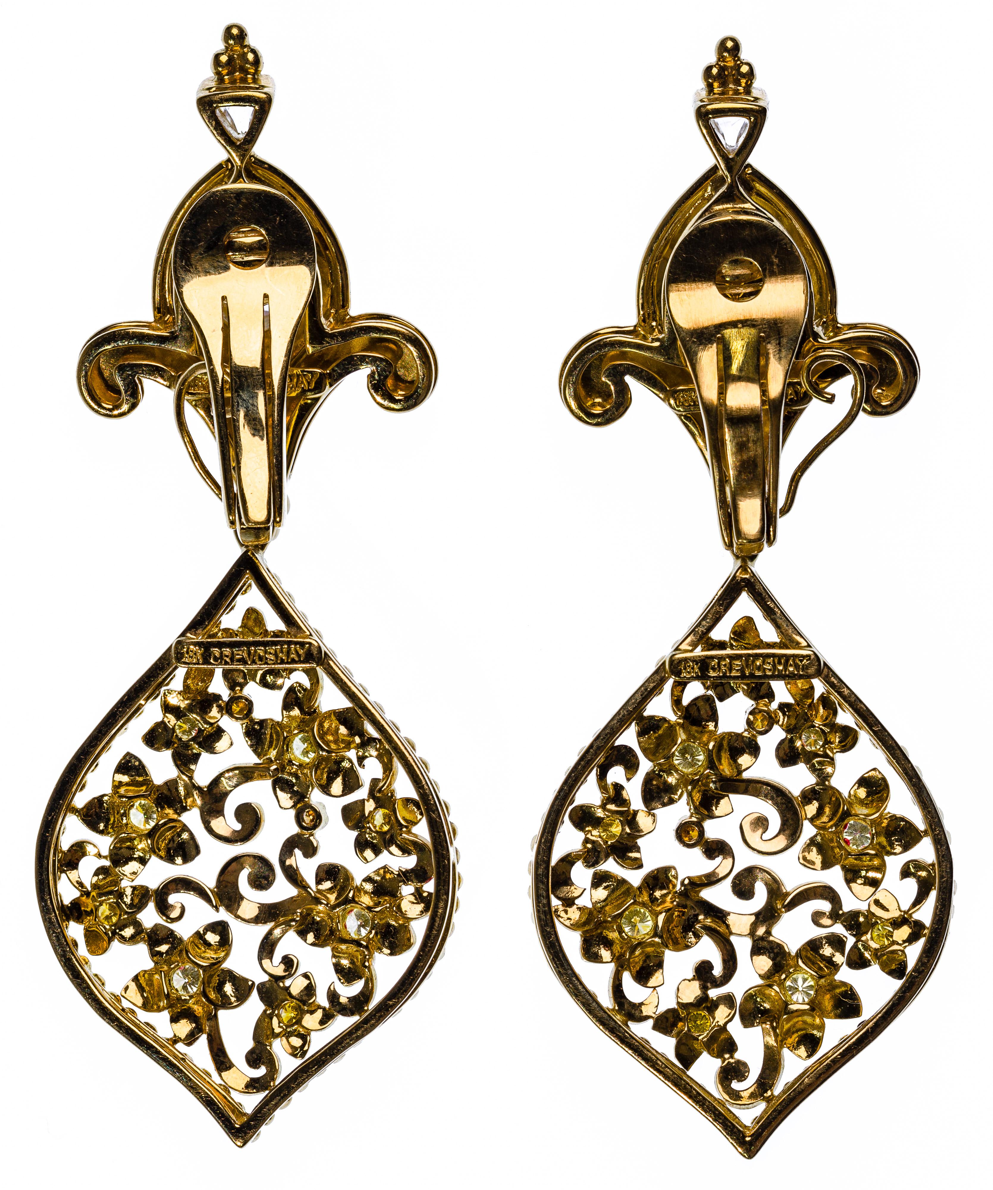 Paula Crevoshay 18k Yellow Gold and Gemstone Clip-on Earring Set. This is a gorgeous pair of open work, floral drop, stamped signed and marked '18k'.



Authenticity Guarantee: All of our items are guaranteed to be authentic designer items. If found