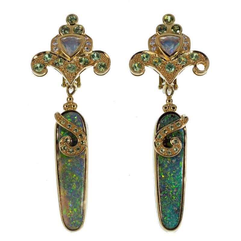 These lovely Paula Crevoshay 18k yellow gold and opal gemstone clip-one earrings are drop style having with a fleur-de-lis design at top, stamped and marked '18k'. Weight: 21.68 dwts.


Authenticity Guarantee: All of our items are guaranteed to be