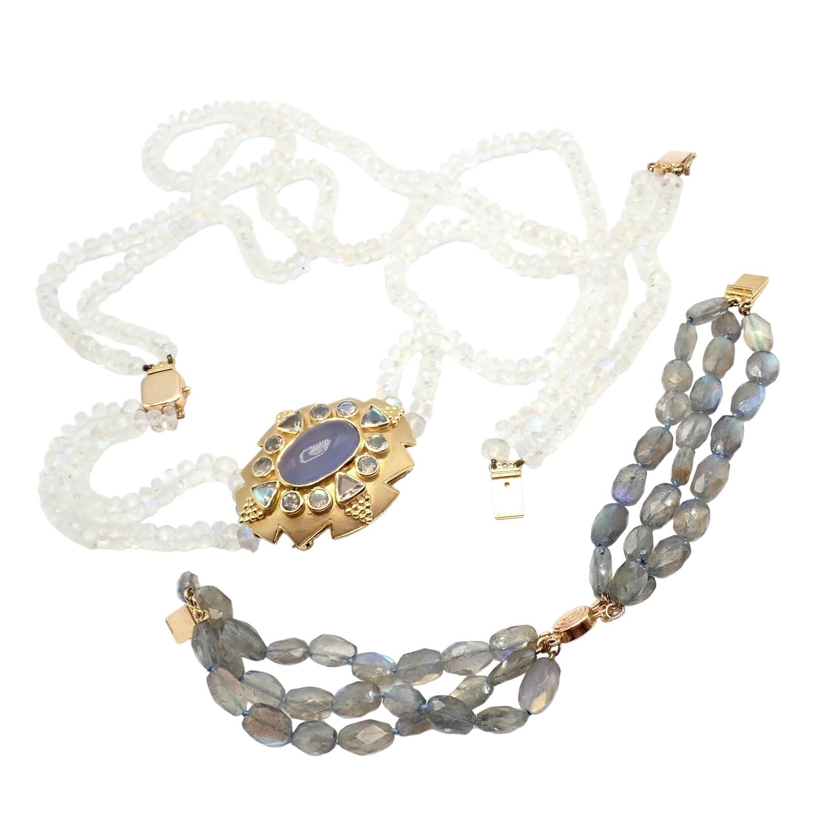 This set by Paula Crevoshay is a magnificant set for every jewelry collector. 

The set includes the main part, a 18k centerpiece bejeweled by moonstones and a oval cabushon chalcedony stone.

The interchangable set can be worn as a bracelet, two