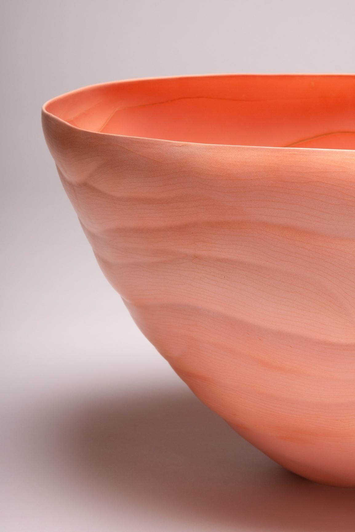 Inspired by forms and patterns found in nature, Paula Murray’s work often reflects the deeply spiritual connection between humans, culture, and the natural world. The intense saffron colour (an ancient pigment and spice) of this vessel accentuates