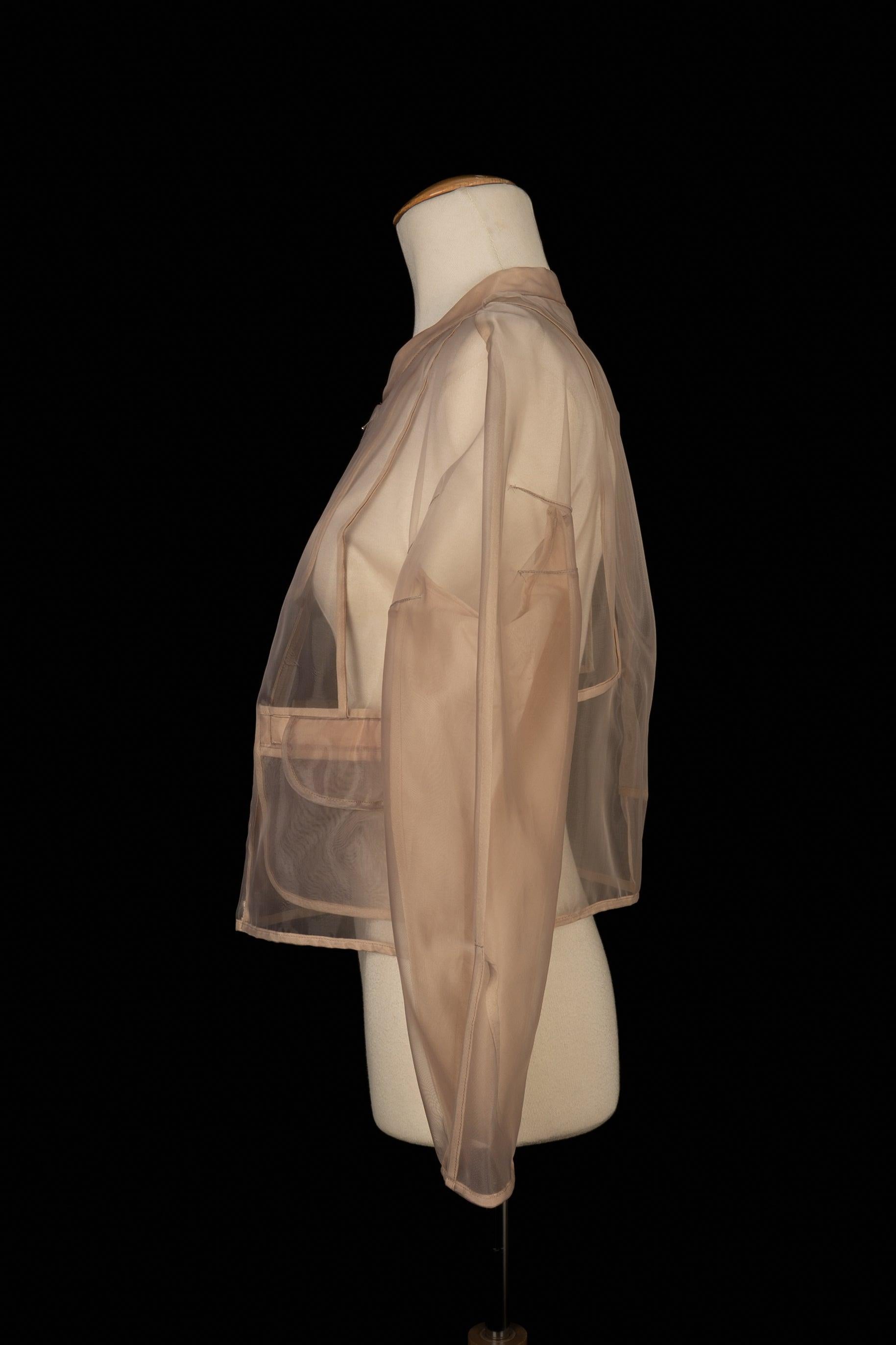 Paule Ka - Nude nylon jacket. Missing size and composition labels, it fits a 38FR.

Additional information:
Condition: Very good condition
Dimensions: Shoulder width: 45 cm - Sleeve length: 55 cm - Length: 49 cm

Seller Reference: FV307