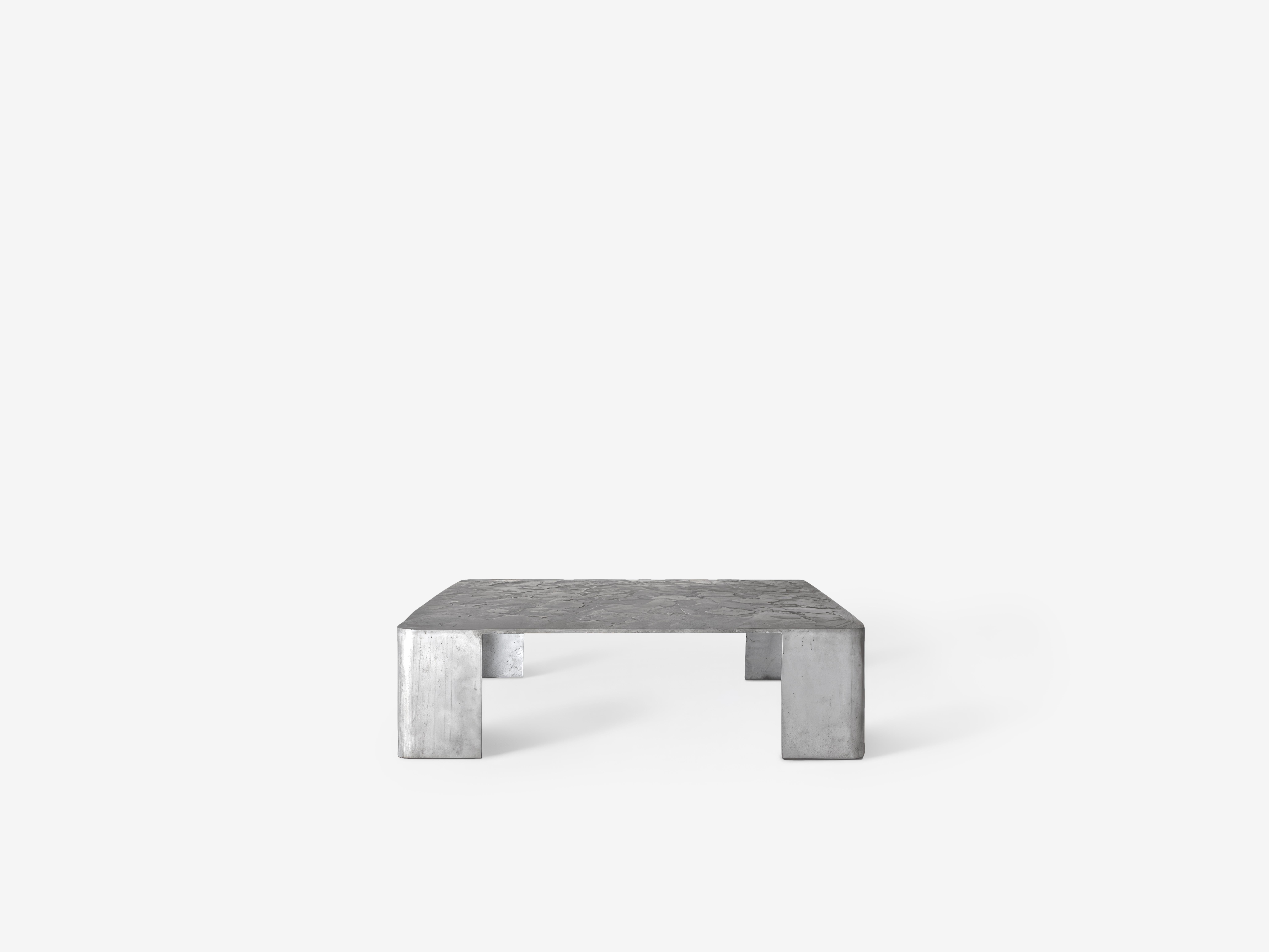 Paulín Coffee Table by OHLA STUDIO
Dimensions: D 110 x W 110 x H 30 cm 
Materials: Brushed Aluminum.
Weight: 48 kg

Is a series of late night conversations, dripping wax on the wood floor,
lighting up the casita on a warm summer night. A piano plays