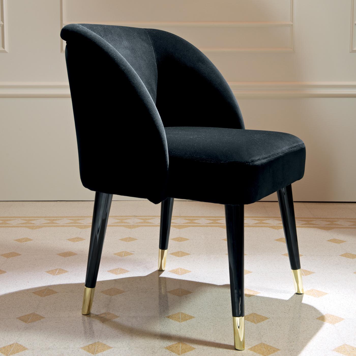 Part of the Pauline Collection, this dining armchair abounds in chic details that will enliven both a modern dining room or a living room seating ensemble, especially when paired with other pieces from the same collection. This retro-inspired design