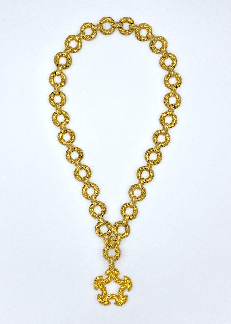 A wonderful 1970s necklace by fashion jewelry designer Pauline Rader. Each strand is comprised of .94 of an inch diameter rope twist ring links .25 of an inch thick. Each ring is connected by .63 of an inch long and .25 of an inch wide bar link.