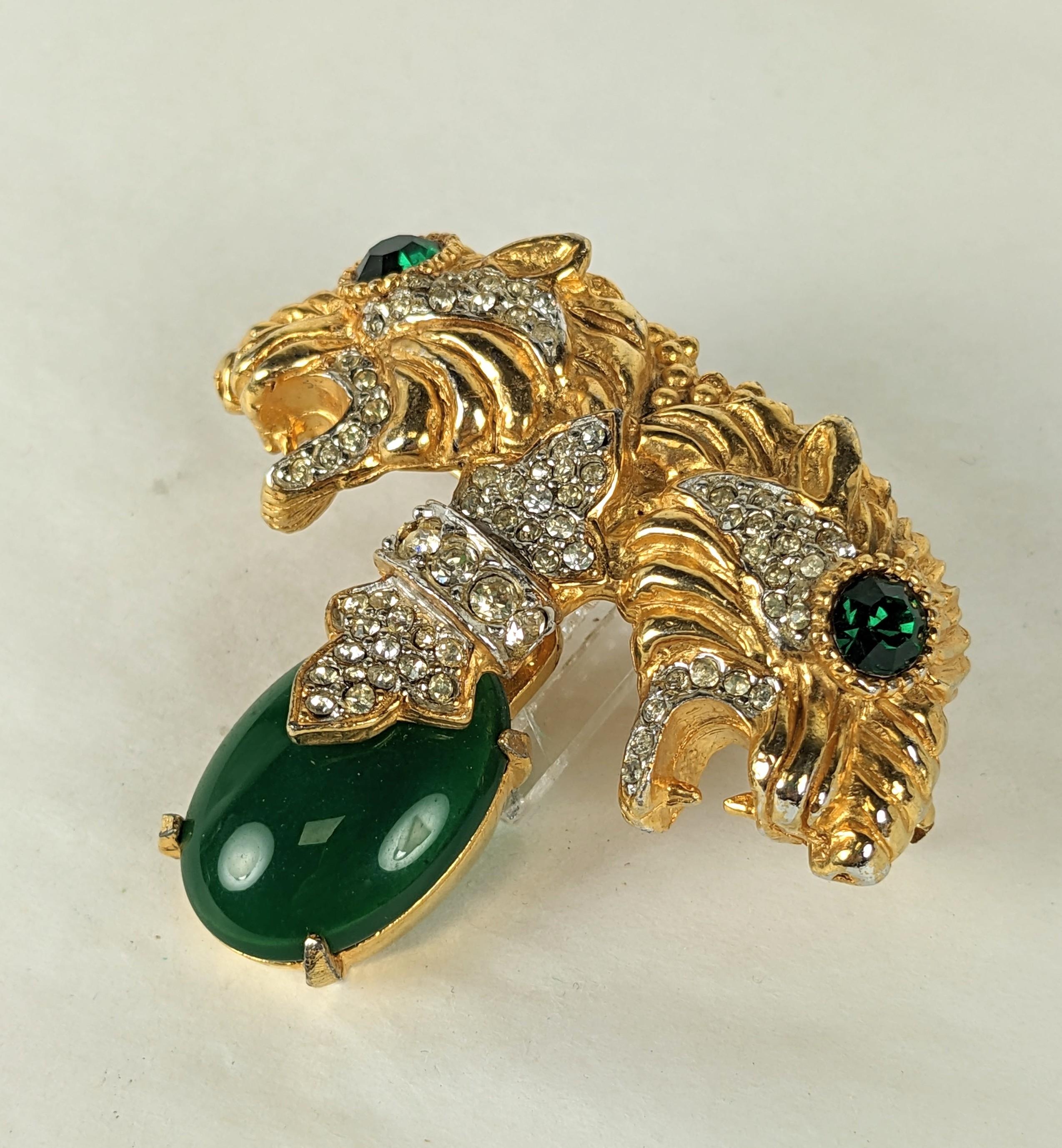 Large, striking Pauline Rader Jeweled Panther Brooch from the 1960's. Double headed brooch with pave accents on top of a large faux emerald cabochon with green paste eyes. 
1960's USA. 2.5