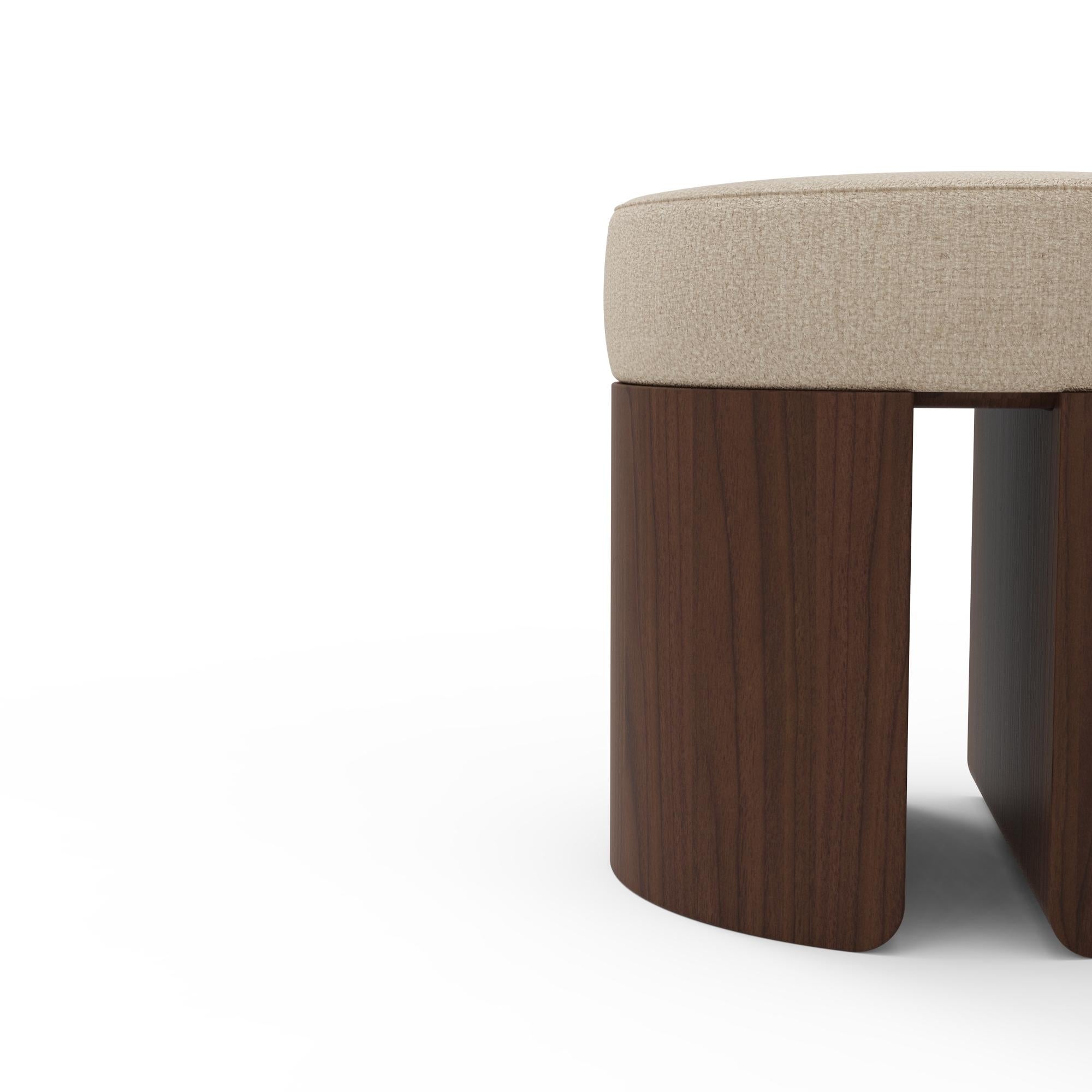 Pauline Stool is a luxury bouclé walnut stool conceived as a compact architectural accent for living spaces, bedrooms, and dressing areas. Its presence is quiet, defined by proportion and material rather than scale. A round upholstered seat in