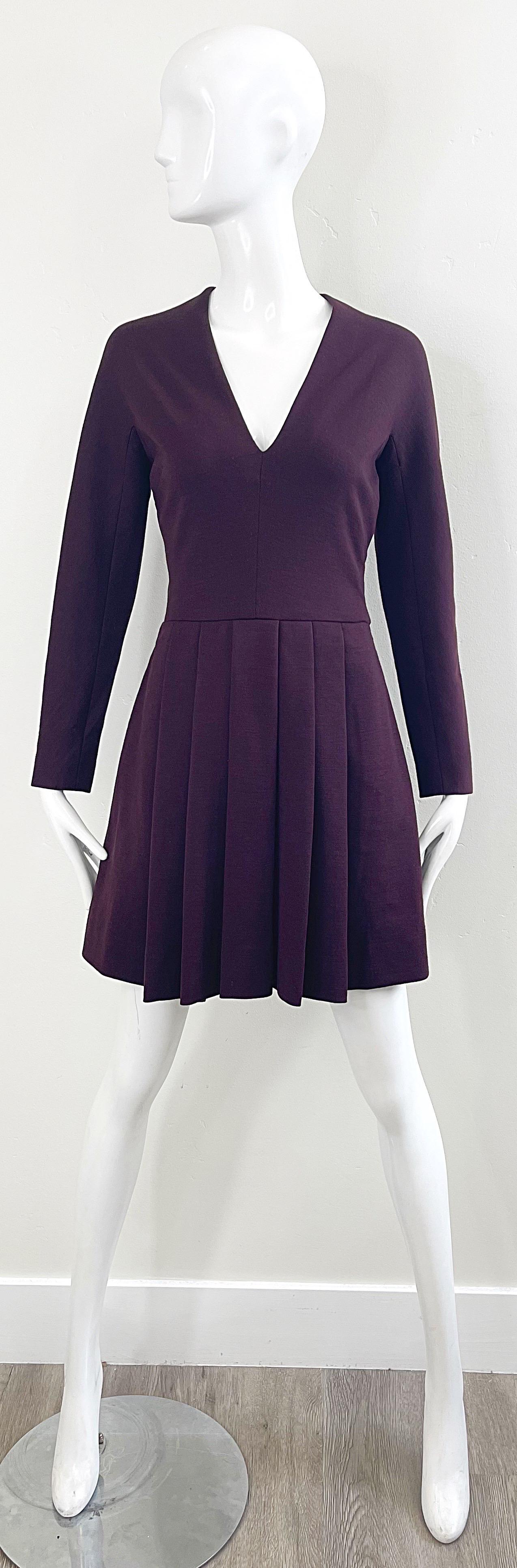 Chic 1970s PAULINE TRIGERE burgundy / maroon long sleeve wool mini dress ! Features a tailored v neck bodice with knife pleat skirt. Hidden zipper up the back with hook-and-eye closure. Perfect for any day or evening event. Pair with flats, heels or