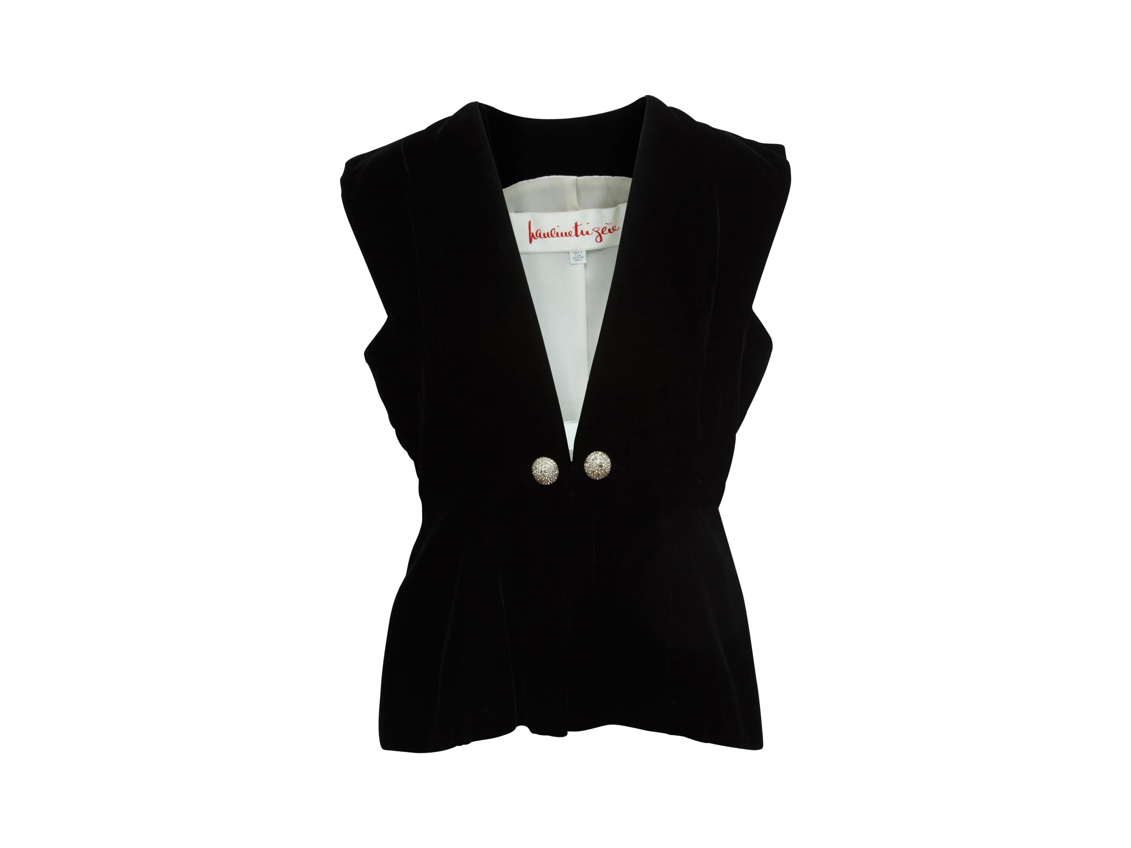 Product details: Vintage black velvet vest by Pauline Trigere.  Sleeveless.  Button-front closure.  Nipped waist.  32