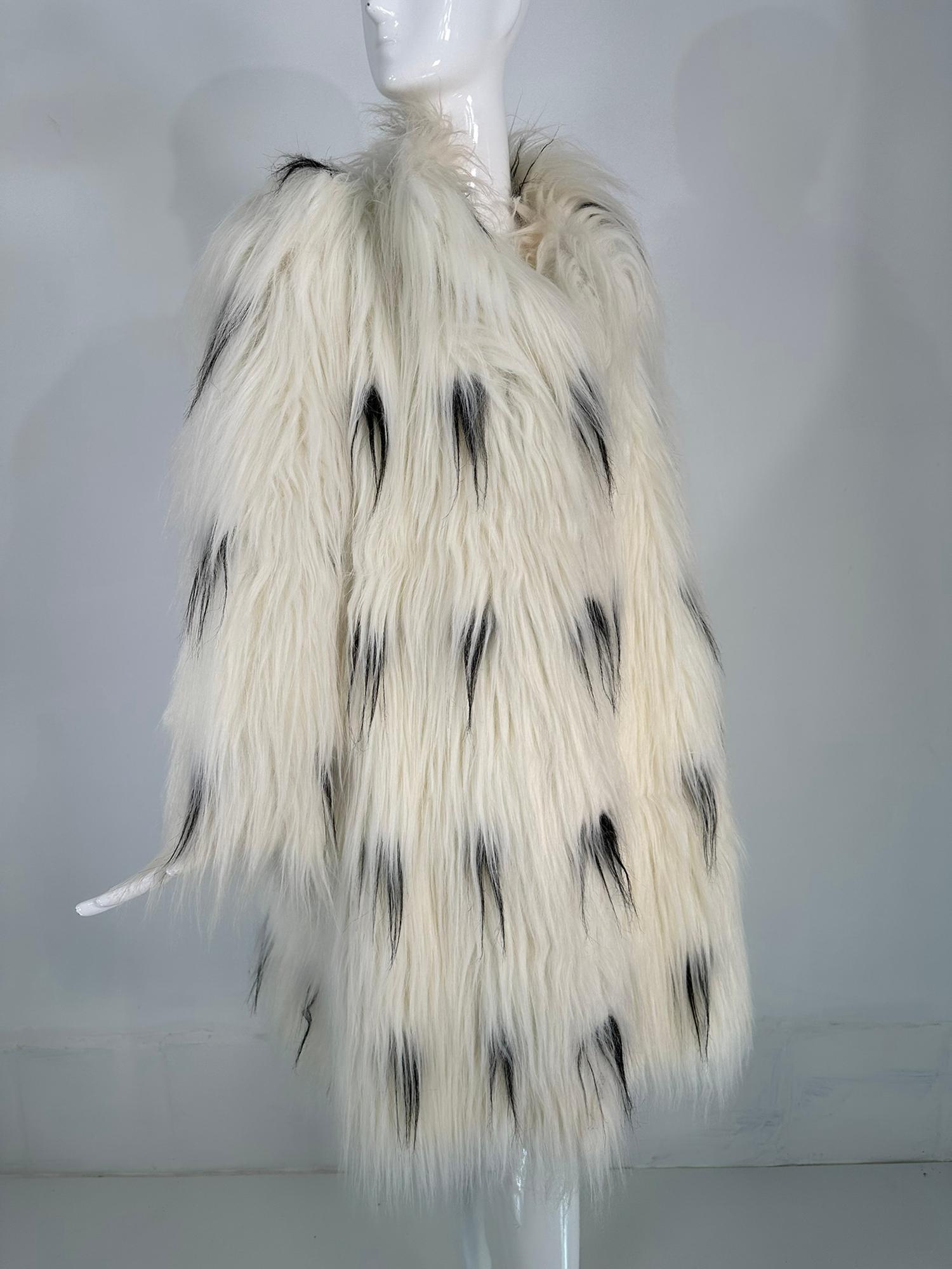 Pauline Trigere black & white shaggy faux fur coat from the 1980s, labeled 'A Trigere Coat'. This eye catching coat is a rare find and perfect for day or evening. Made from synthetic faux fur that looks like monkey or goat hair. Long 