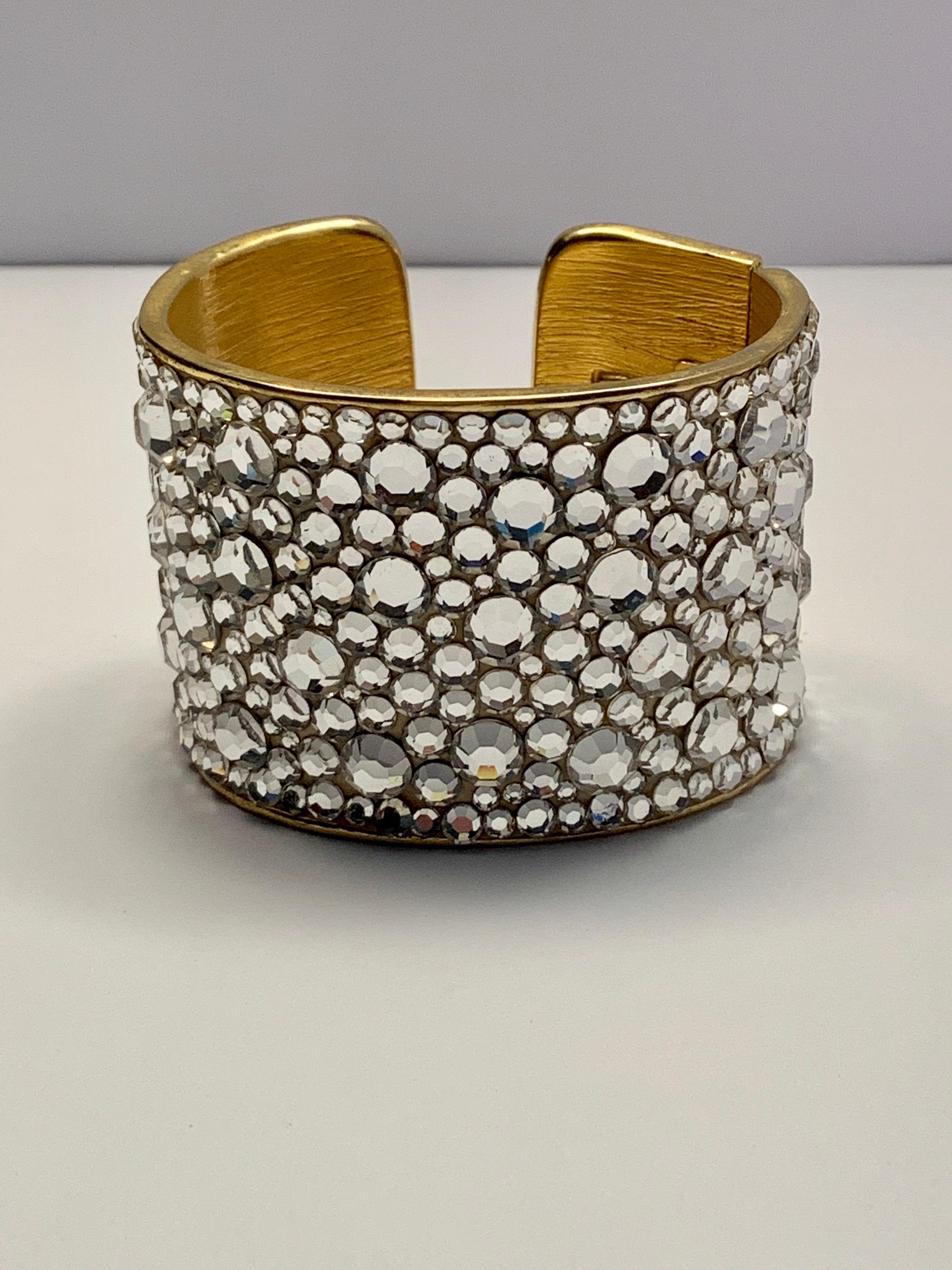 Fashion designer Pauline Trigere was a jewelry lover, and she designed and sold fashion jewelry as well as fine jewelry. This stunning cuff is from her fashion jewelry line. It is covered with faceted rhinestones in various sizes. It catches the