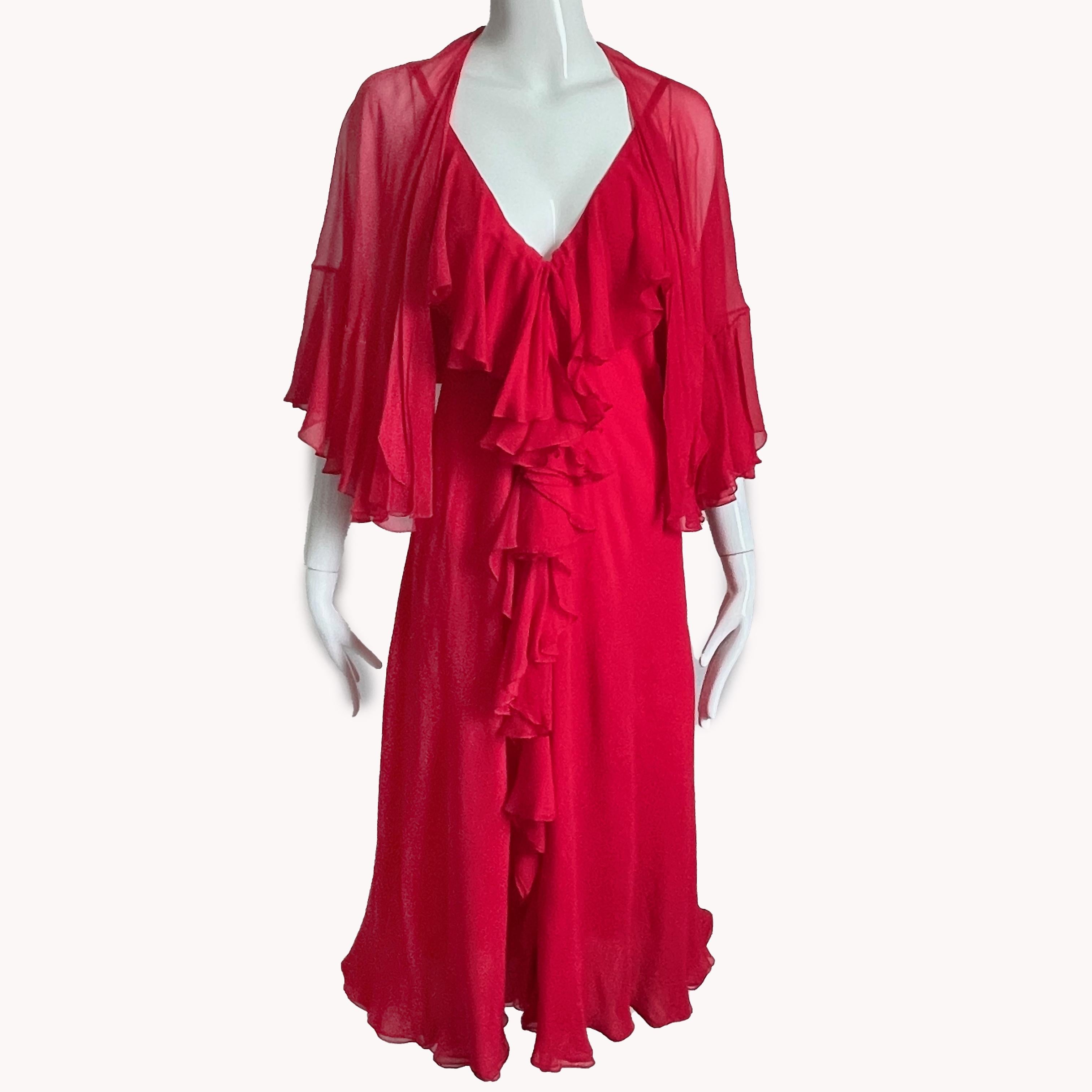 Authentic, preowned, vintage Pauline Trigère red ruffle cocktail dress with Shawl, made from silk chiffon, most likely in the early 70s. 

A true vintage piece with a studio 54 or disco vibe!  Both pieces are made from red silk chiffon; the