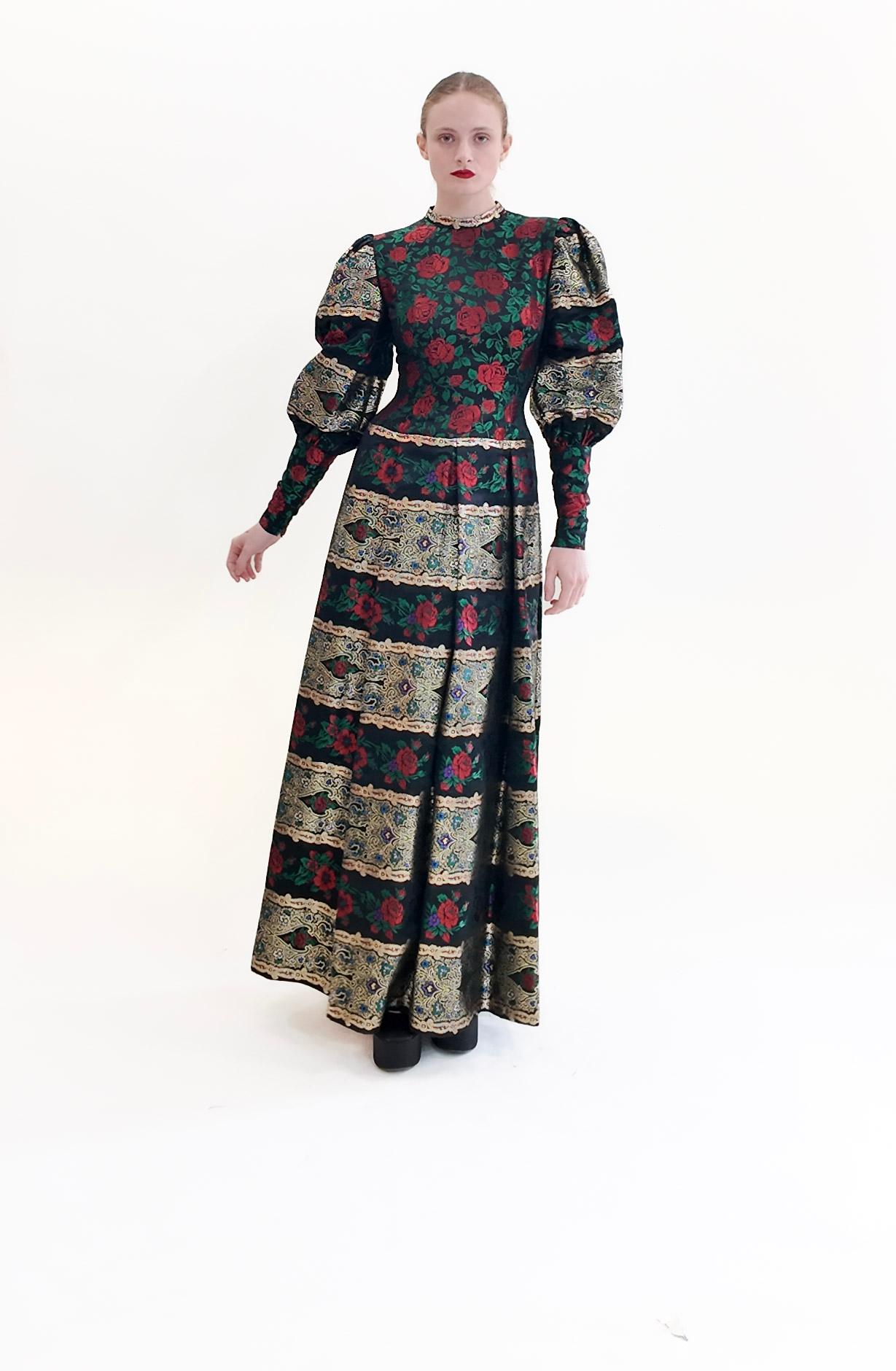 Indulge in luxury with the Pauline Trigere Long Sleeve Brocade Floral Print Metallic Gown. Made with intricate brocade fabric and a shimmering metallic finish, this holiday gown will make you feel like royalty. Perfect for any special occasion, it's