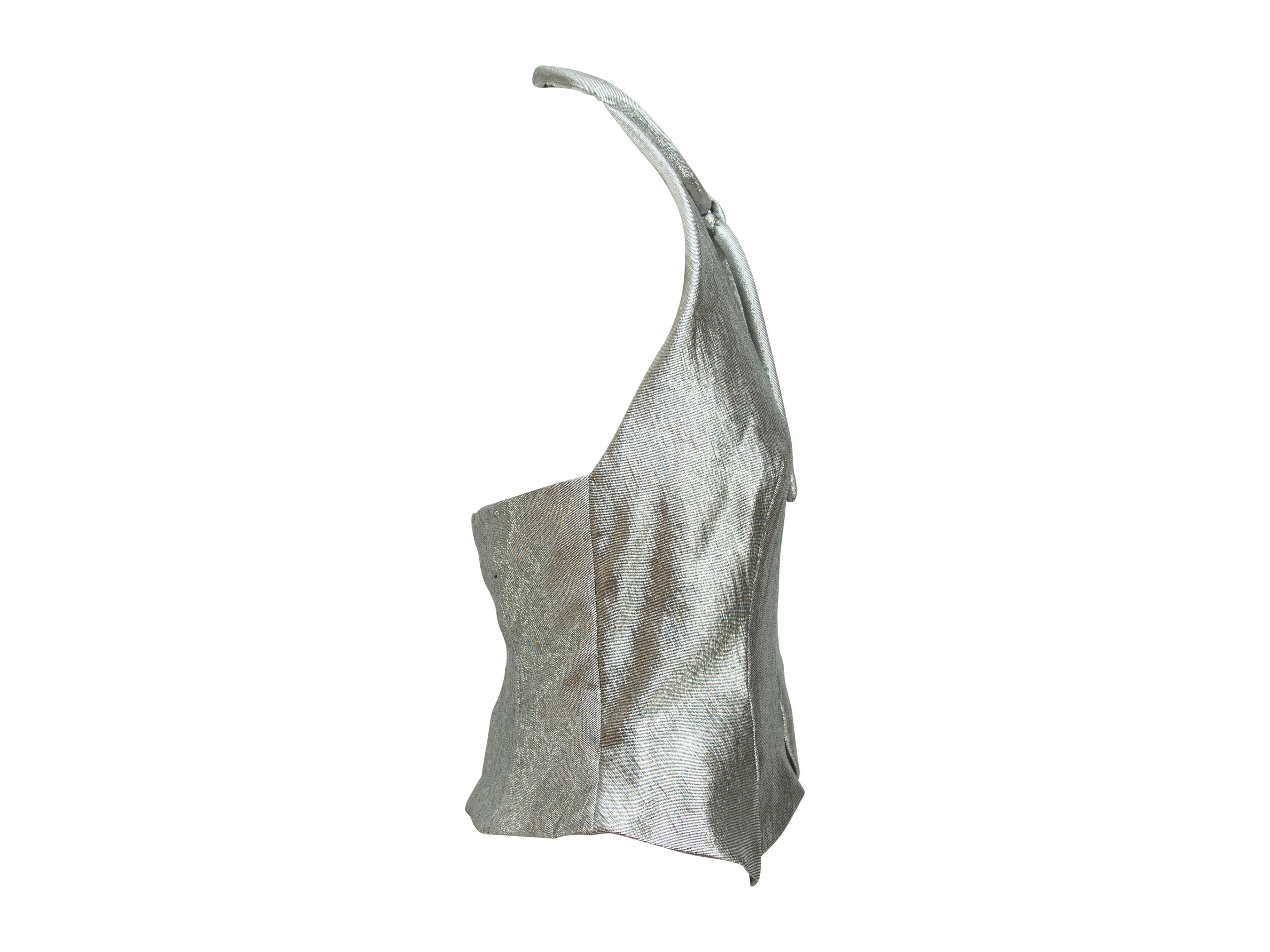 Product details:  Vintage metallic silver lame top by Pauline Trigere.  Circa the 1970s/1980s.  Halterneck.  Straps accent neck.  Sleeveless.  Convertible bodice design.  34