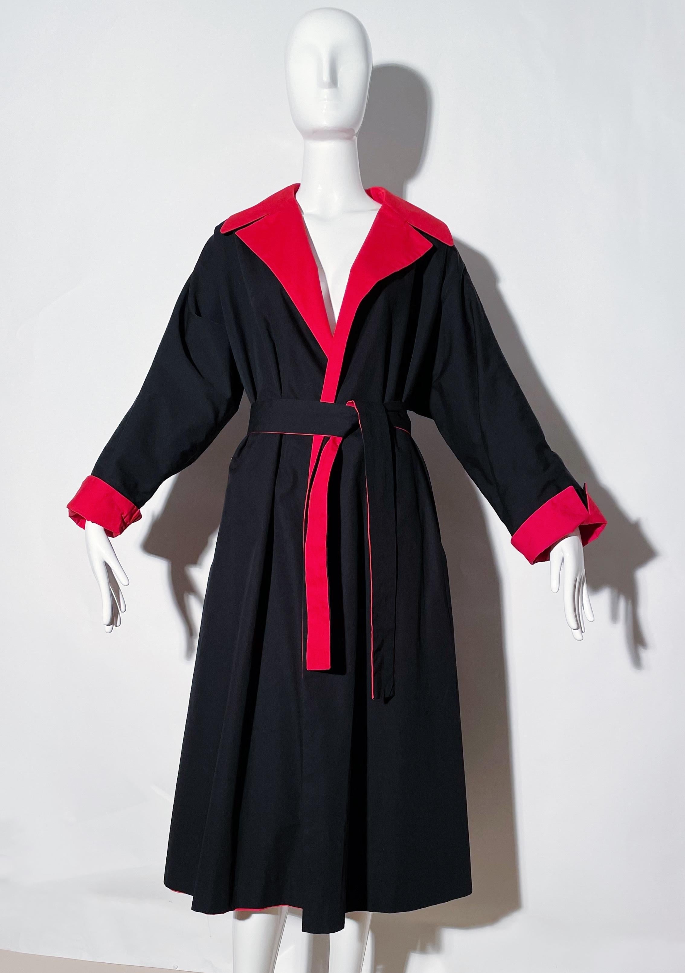 Red/ Black trench coat. Reversible. Side pockets. Collared. Belted, removeable. Cotton and polyester blend. Made in Hong Kong.
*Condition: excellent vintage condition. No visible flaws.

Measurements Taken Laying Flat (inches)—
Shoulder to Shoulder: