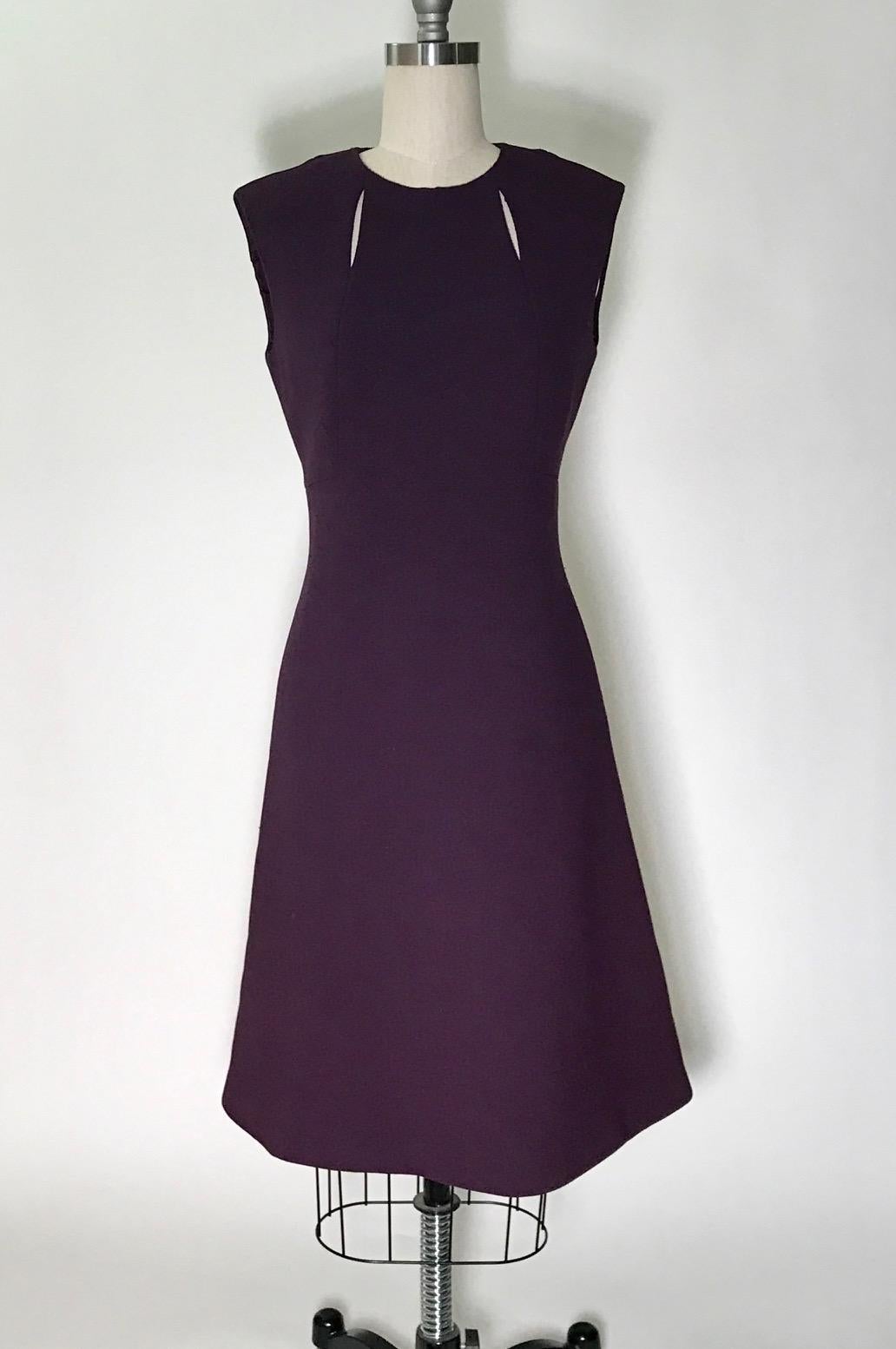 Vintage Pauline Trigere 1960s purple wool crepe A-line shift dress with open slit detail at chest. L-shaped seams at bodice. Back zip and hook and eye.

Fully lined in silky fabric. 

No size tag, see measurements.
Bust 35
