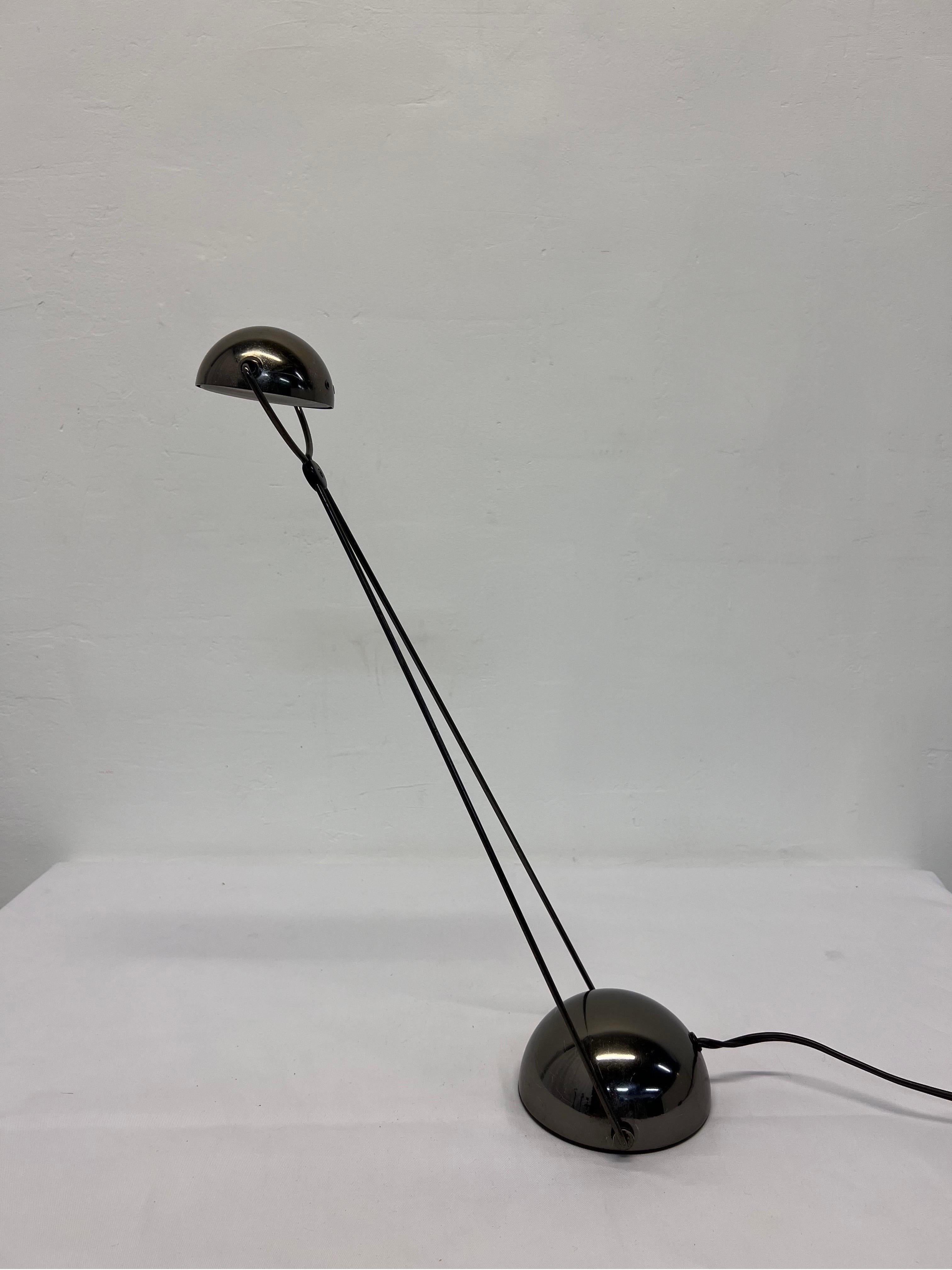 Postmodern table desk or task lamp, articulating and adjustable design rendered in gunmetal gray metal and plastic, designed by Paolo Piva for Stefao Cevoli, Italy, 1980s.