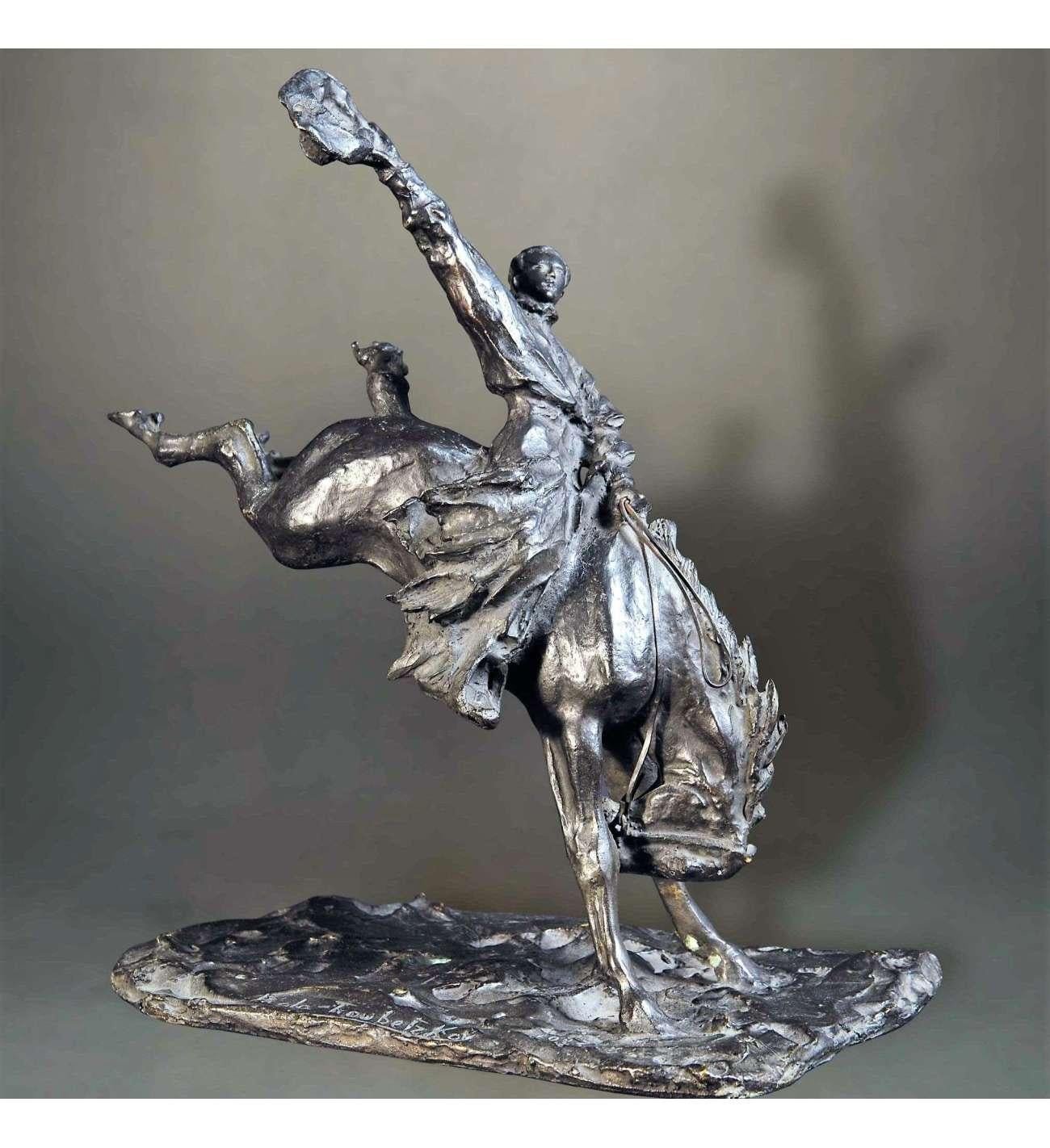 This striking bronze cowboy sculpture by renowned artist Paolo Troubetzkoy depicts a cowboy riding a bucking bronco. Cast in bronze and featuring a rich brown patina, this dynamic piece captures the spirit of the American West. Signed by the artist,
