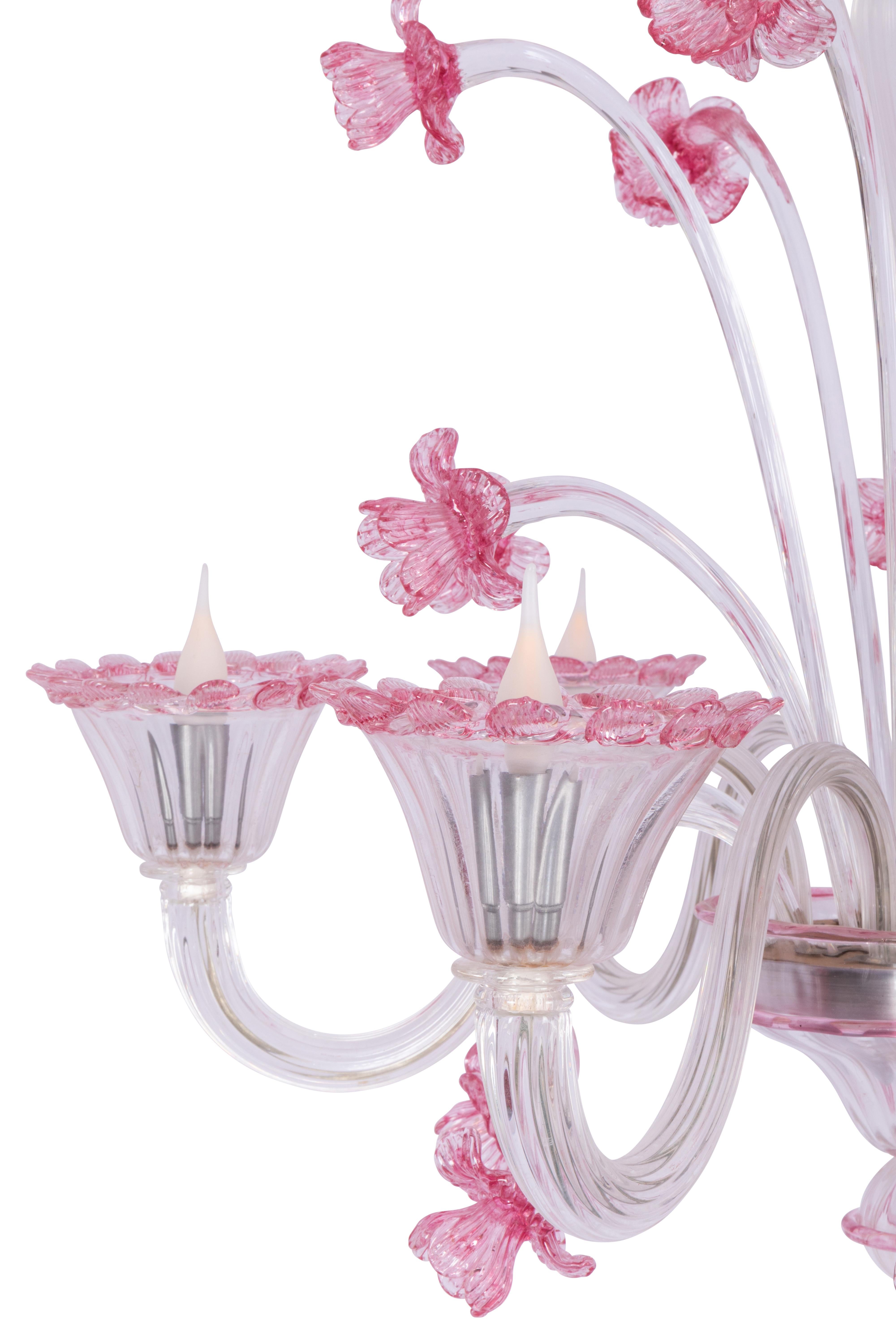 Classic coloured Murano blown and bent glass Pastoral chandelier with festive floral design elements; richly decorated with flowers and leaves in transparent or pink glass.

The chandelier has 6 arms and lights, is in perfect condition and dates