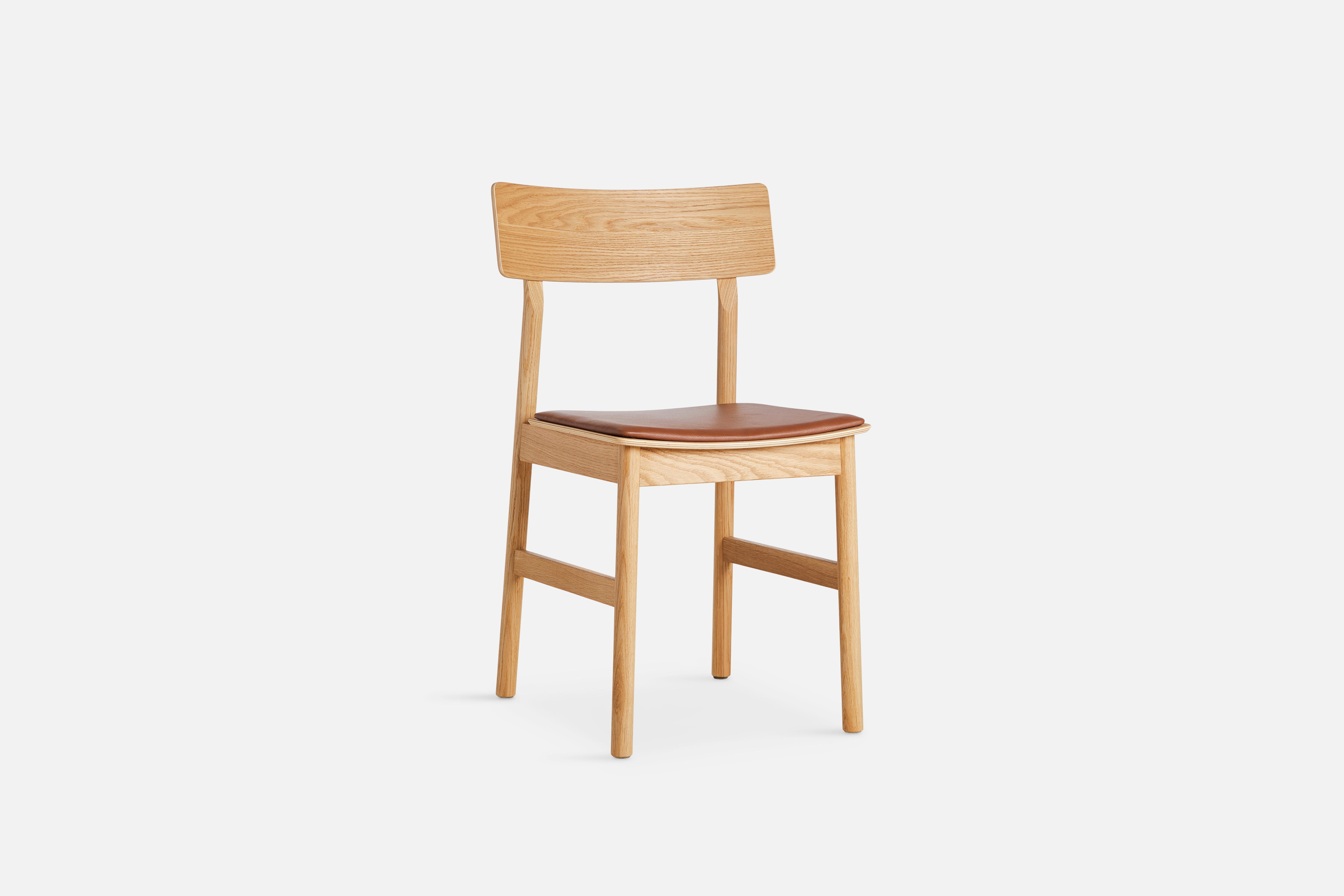 Pause oiled oak dining chair 2.0 with leather seat by Kasper Nyman.
Materials: ash, plywood, leather, upholstery.
Dimensions: D 47 x W 48 x H 80 cm.
Also available in different colours and finishes.

The founders, Mia and Torben Koed, decided