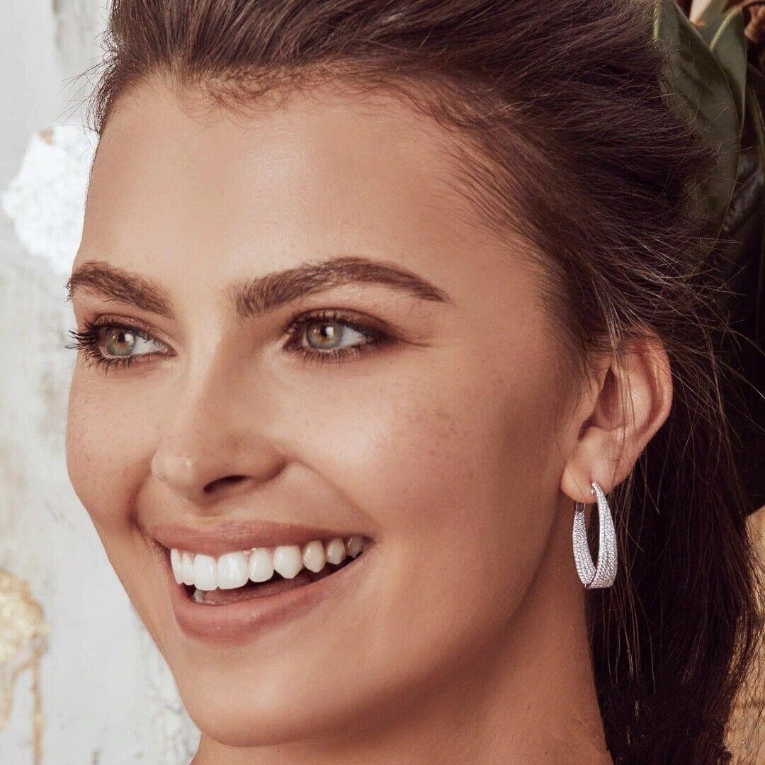 Diamond (1.72 total carat weight) pave hoop earrings in 14k white gold. The earrings are designed and handmade locally in Los Angeles by Sage Designs L.A. using earth-mined and conflict free diamonds. The hoop dimensions are 0.85