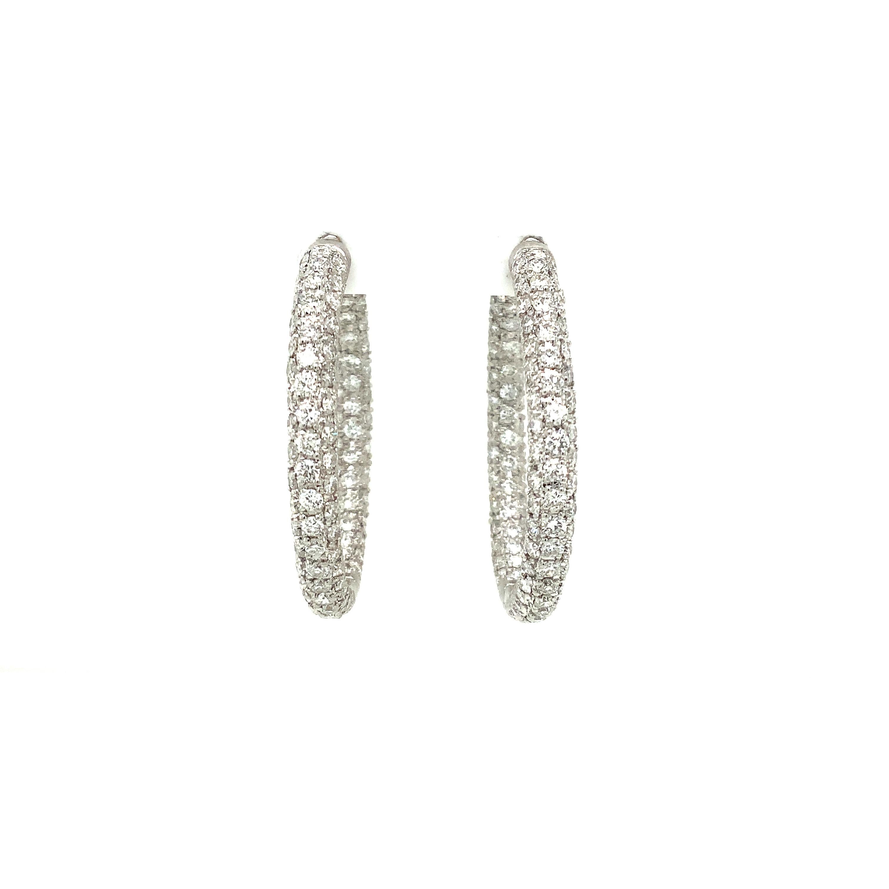  Pavé 3 Row Round Inside -Outside Diamond Hoop Earrings Set in 18K White Gold. 

This Earring contains 210 Round Brilliant Cut Diamonds securely set into this magnificent 3 3-row round Inside-Outside Diamond Hoop earring set, crafted in 18K White