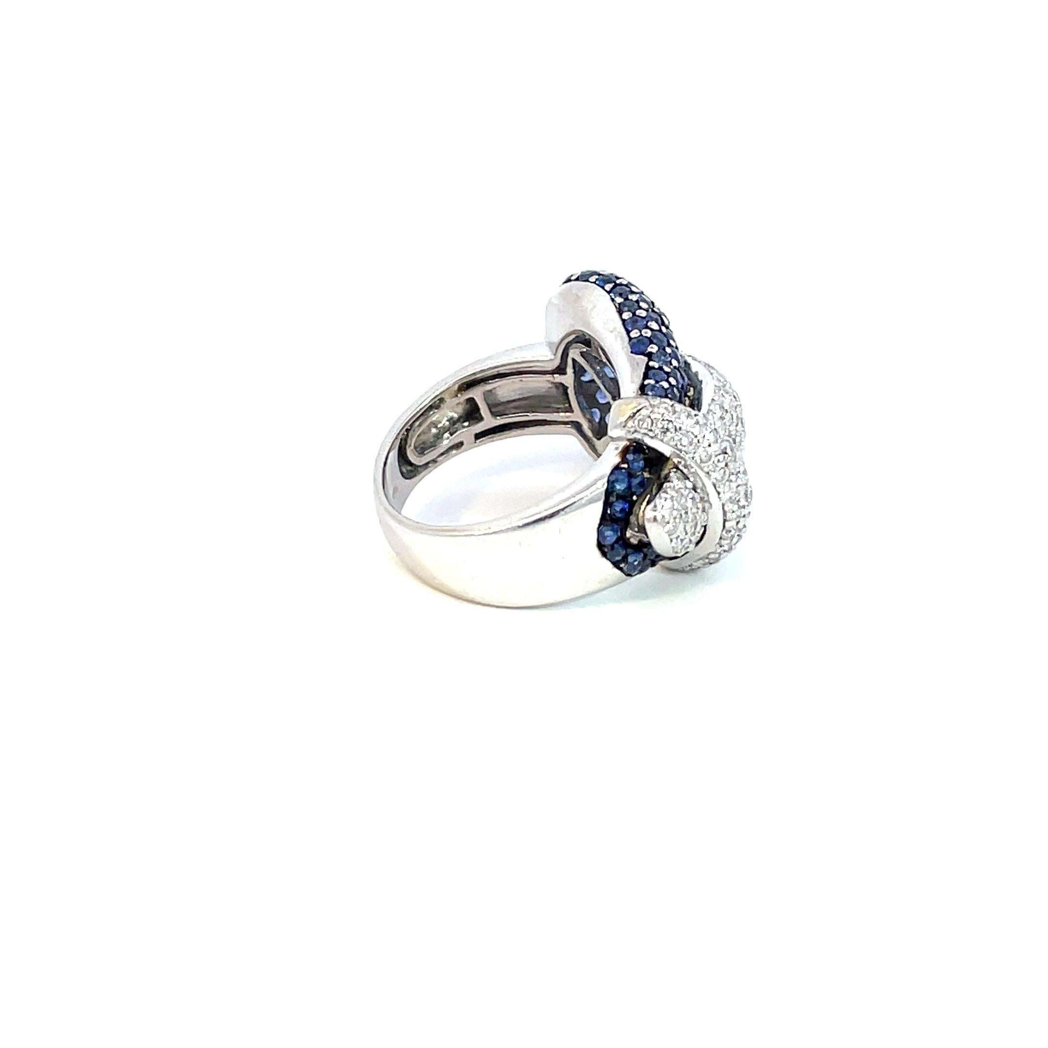 Contemporary Pavé Buckle Ring with Natural Blue Sapphire & Natural Diamond in 18kt White Gold For Sale