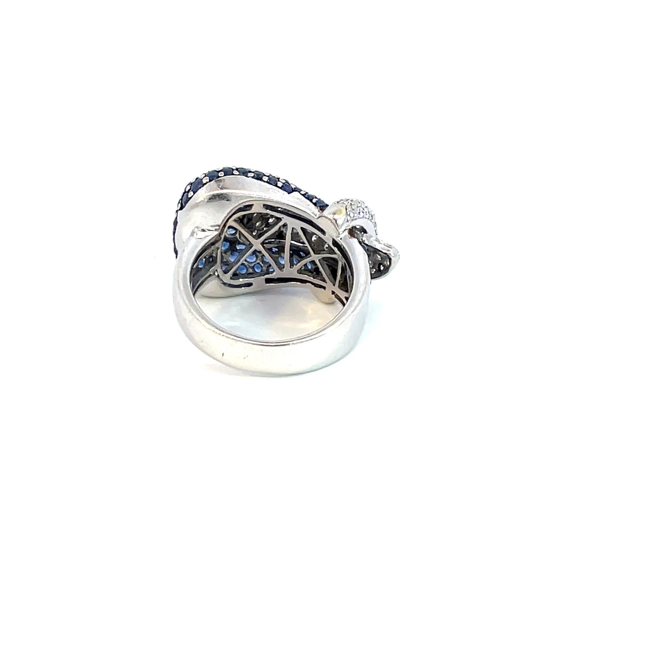 Round Cut Pavé Buckle Ring with Natural Blue Sapphire & Natural Diamond in 18kt White Gold For Sale