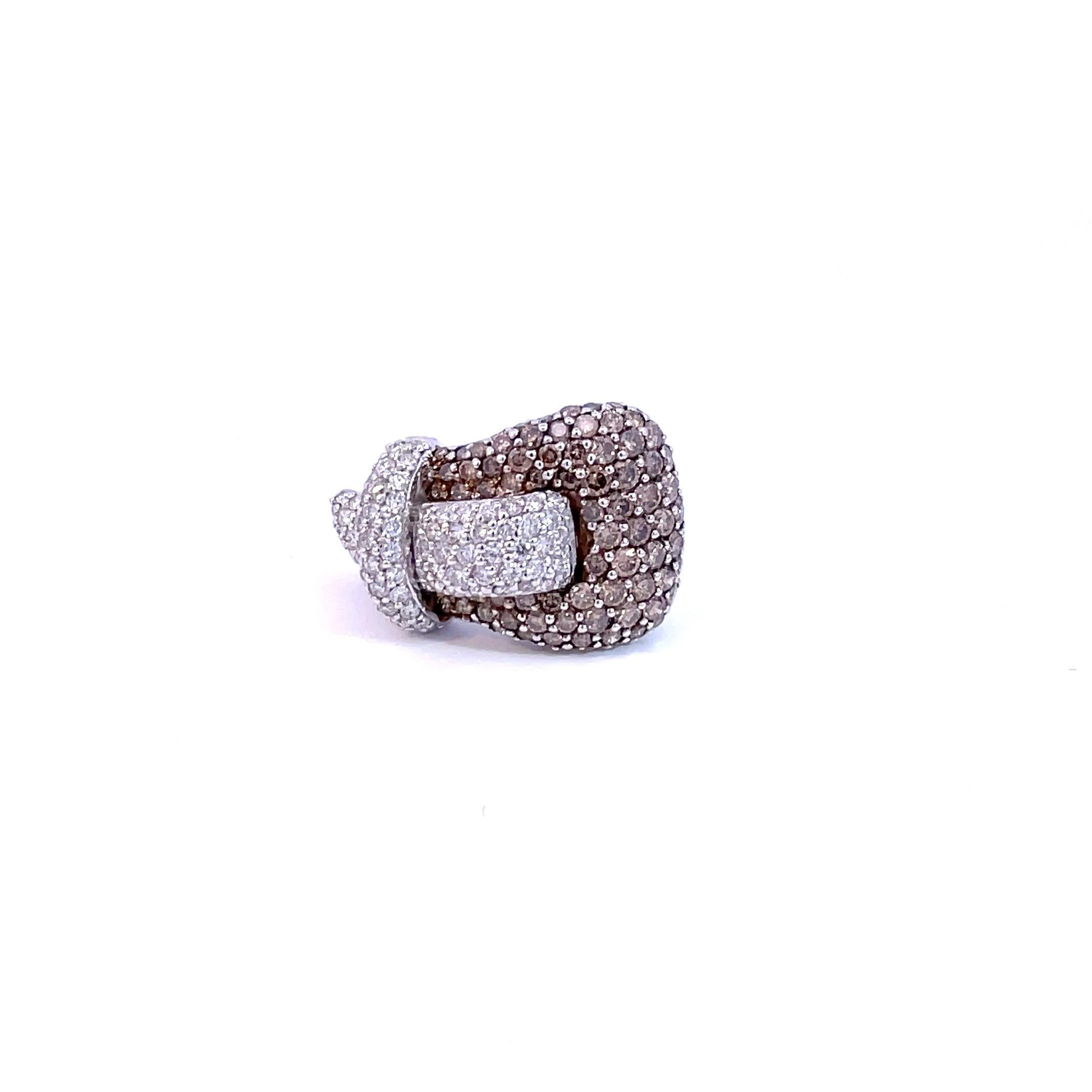 One natural brown diamond & natural white diamond Buckle Ring meticulously set with only the  finest quality brilliant cut diamonds.

98 round cut natural brown diamonds weighing 2.48ct total weight

80 brilliant cut diamonds weighing 0.73ct total