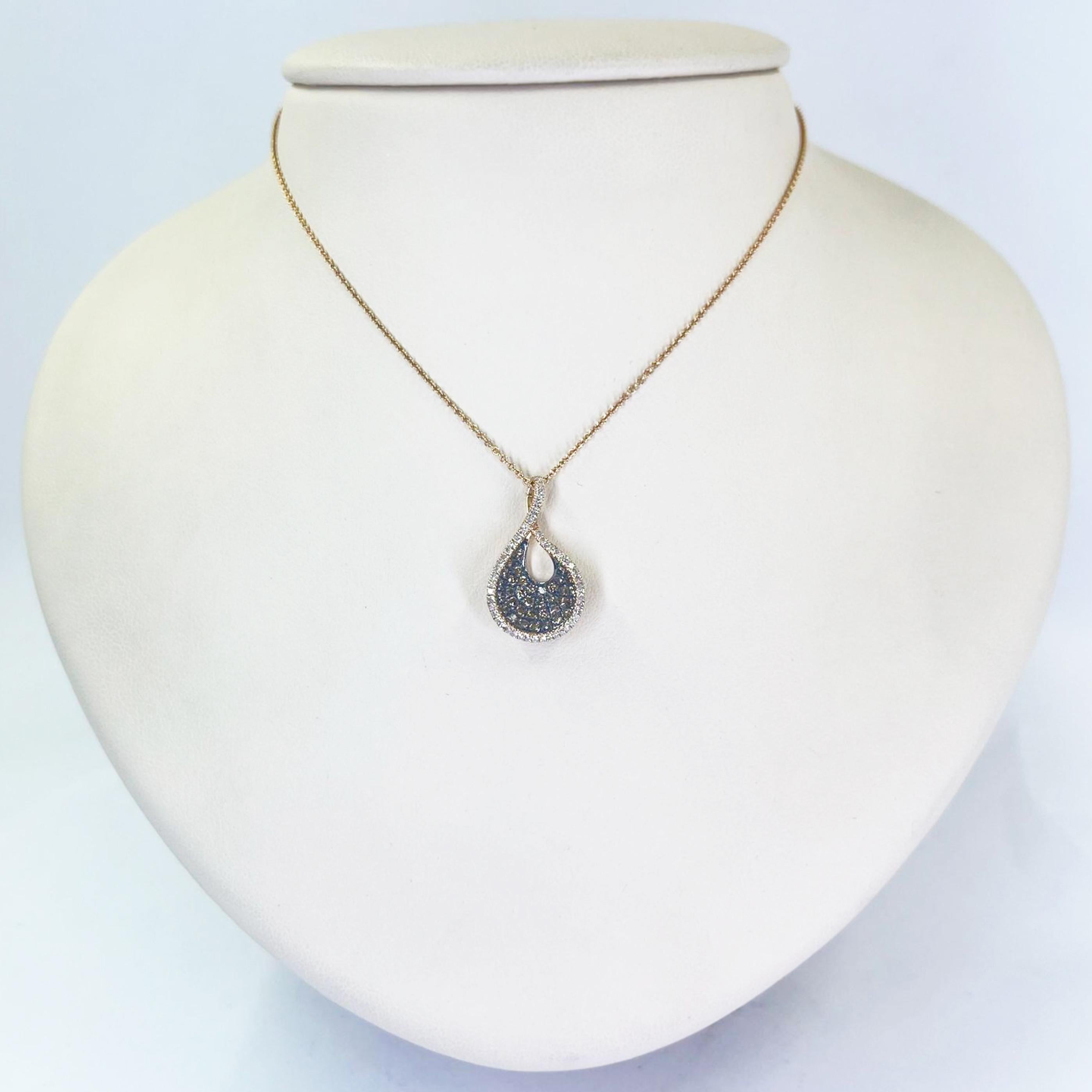 14 karat rose gold pendant necklace featuring 35 round chocolate diamonds totaling 0.33 carats accented by 50 single cut diamonds of I1 clarity and I color totaling 0.17 carats. 16 inch chain with 1 inch drop pendant. Finished weight is 2.7 grams.