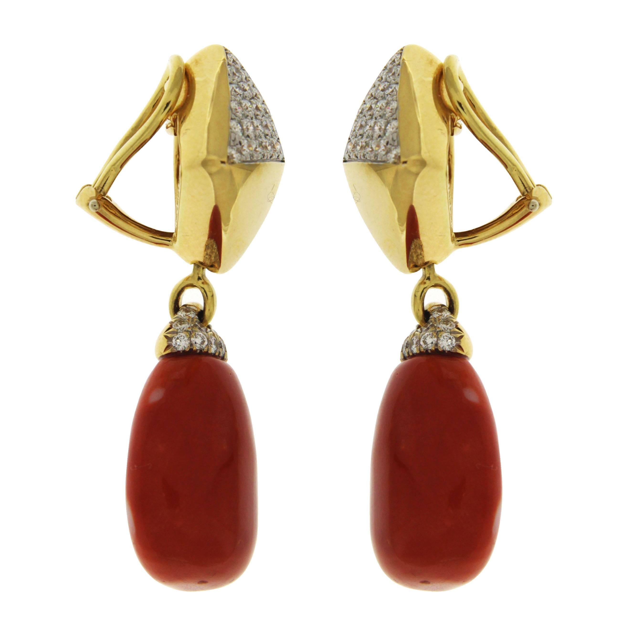This pair of unique earrings is designed with Pyramid pave and removable  drop of Sardinian Coral Earrings. The earrings are finished in 18kt yellow gold and clips.
