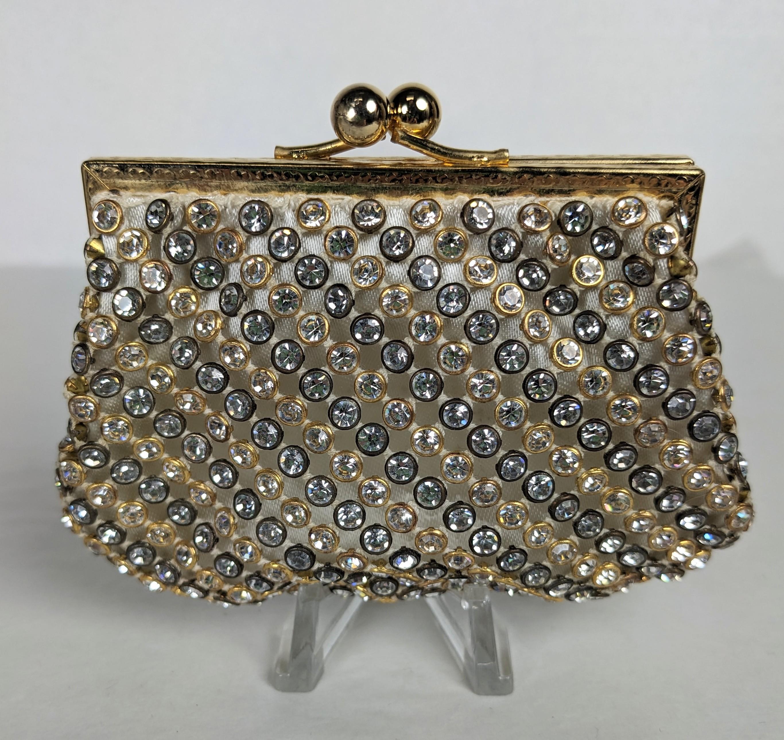 Charming Pave Crystal Change Purse, Retailed by Lancel from the 1950's. Made with bezel set crystals in silver and gold diagonal setting on a white satin base, 1950's France. 4