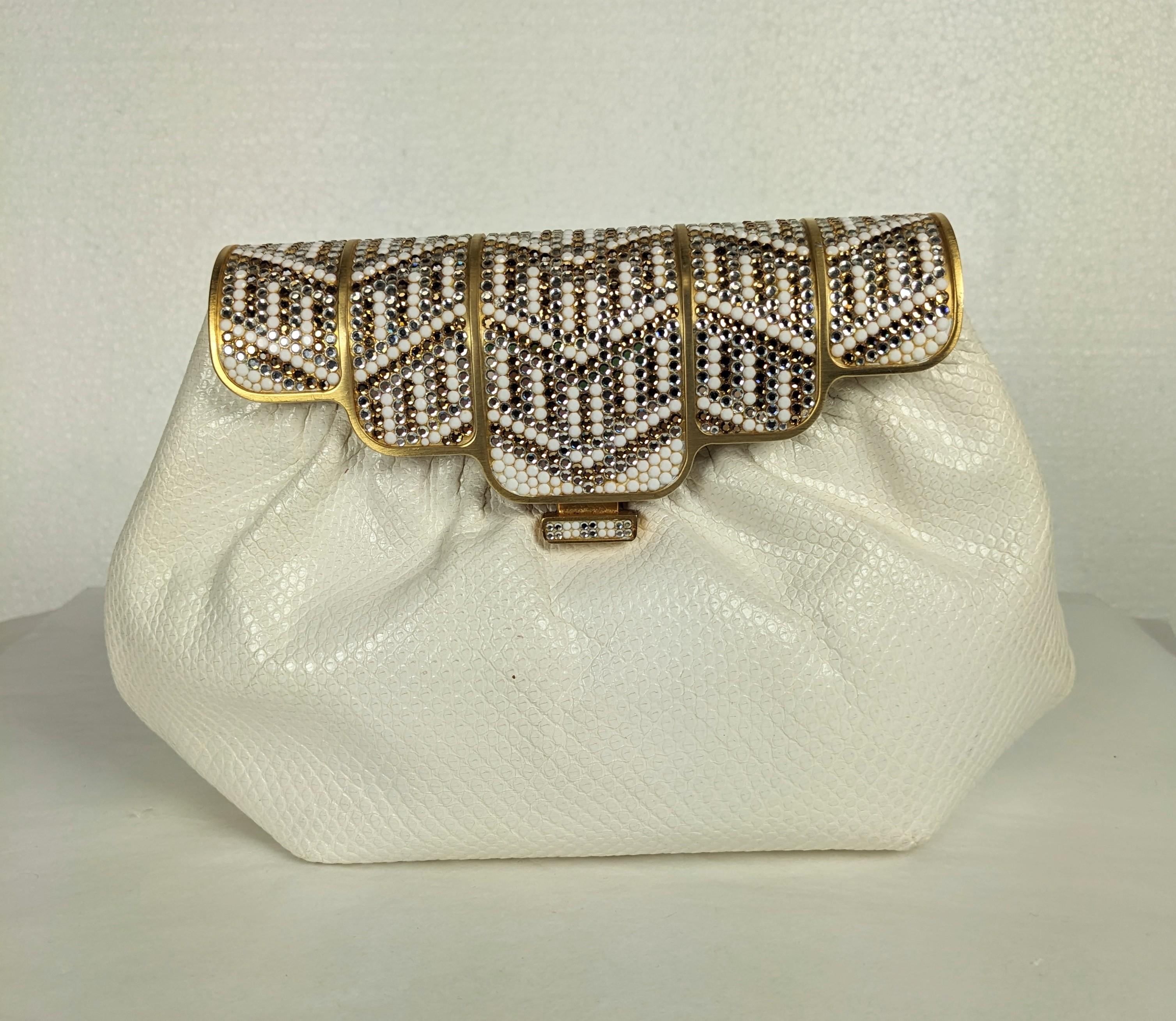 Pave Crystal Snakeskin Clutch by Finesse La Model made in the Judith Lieber style. A large frame is hand encrusted with clear and white crystal stones on gilt metal on a gathered ivory snakeskin body. Includes original comb and mirror, appears