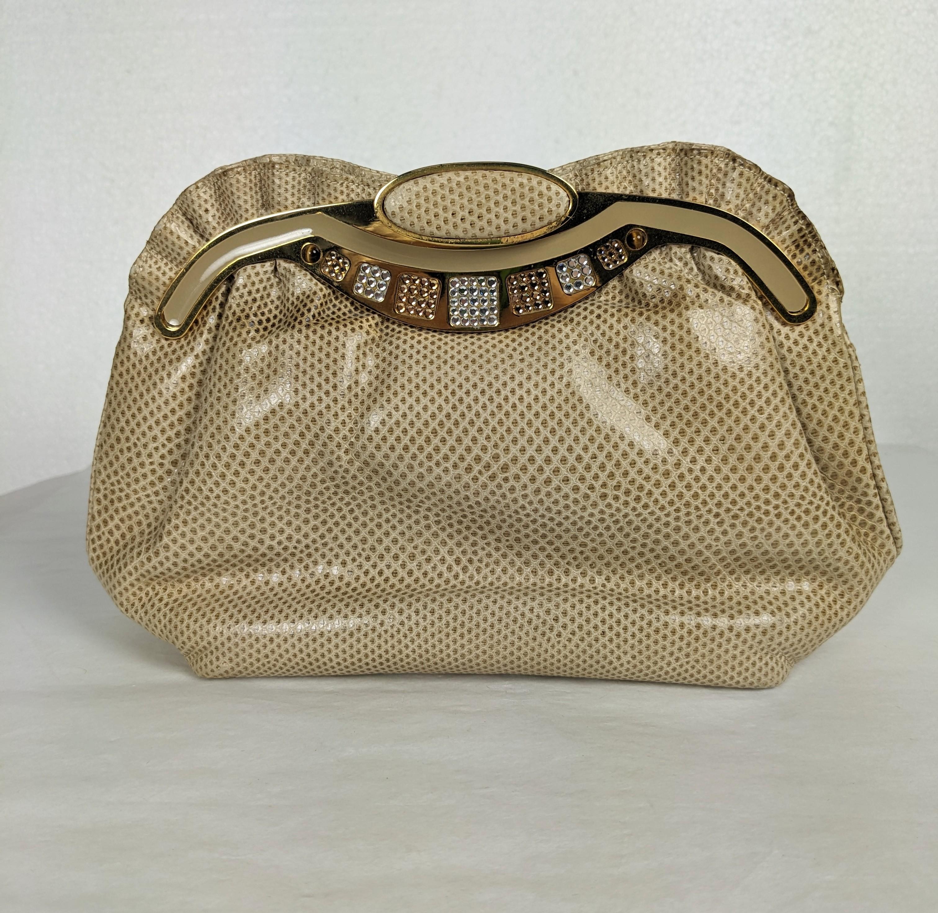 Pave Crystal Snakeskin Clutch by Finesse La Model made in the Judith Lieber style. A inset frame is hand encrusted with clear and topaz crystal stones with tiger eye cabochons on gilt metal on a ruffled beige snakeskin body. Includes original 