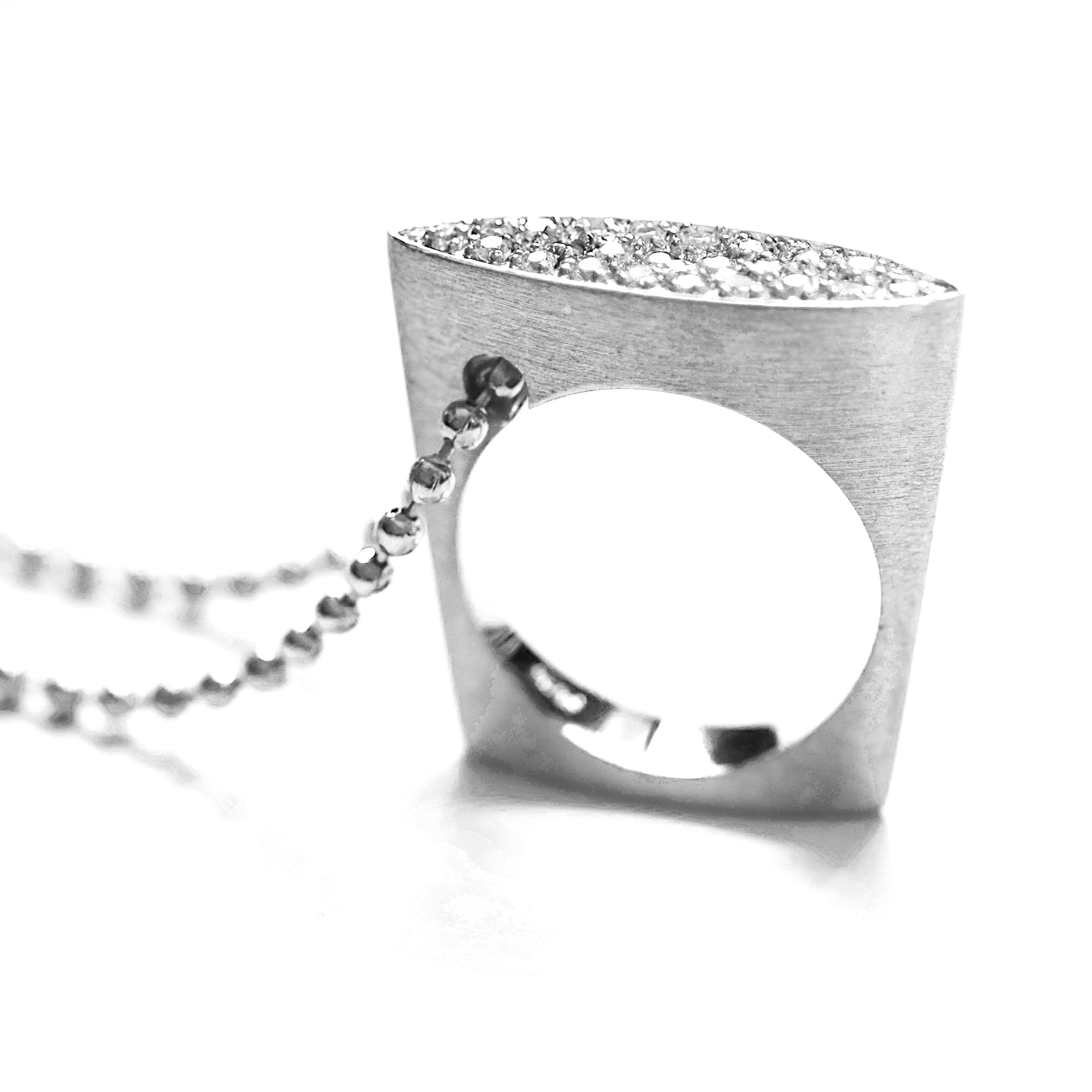 An archive piece from Mirage collection by Jewellery Quarter-based designer. Wear as a ring or with the ball chain necklace, the Mirage pendant/ring is sculptural in form and modern in style. The brushed finish and high polish give a contemporary