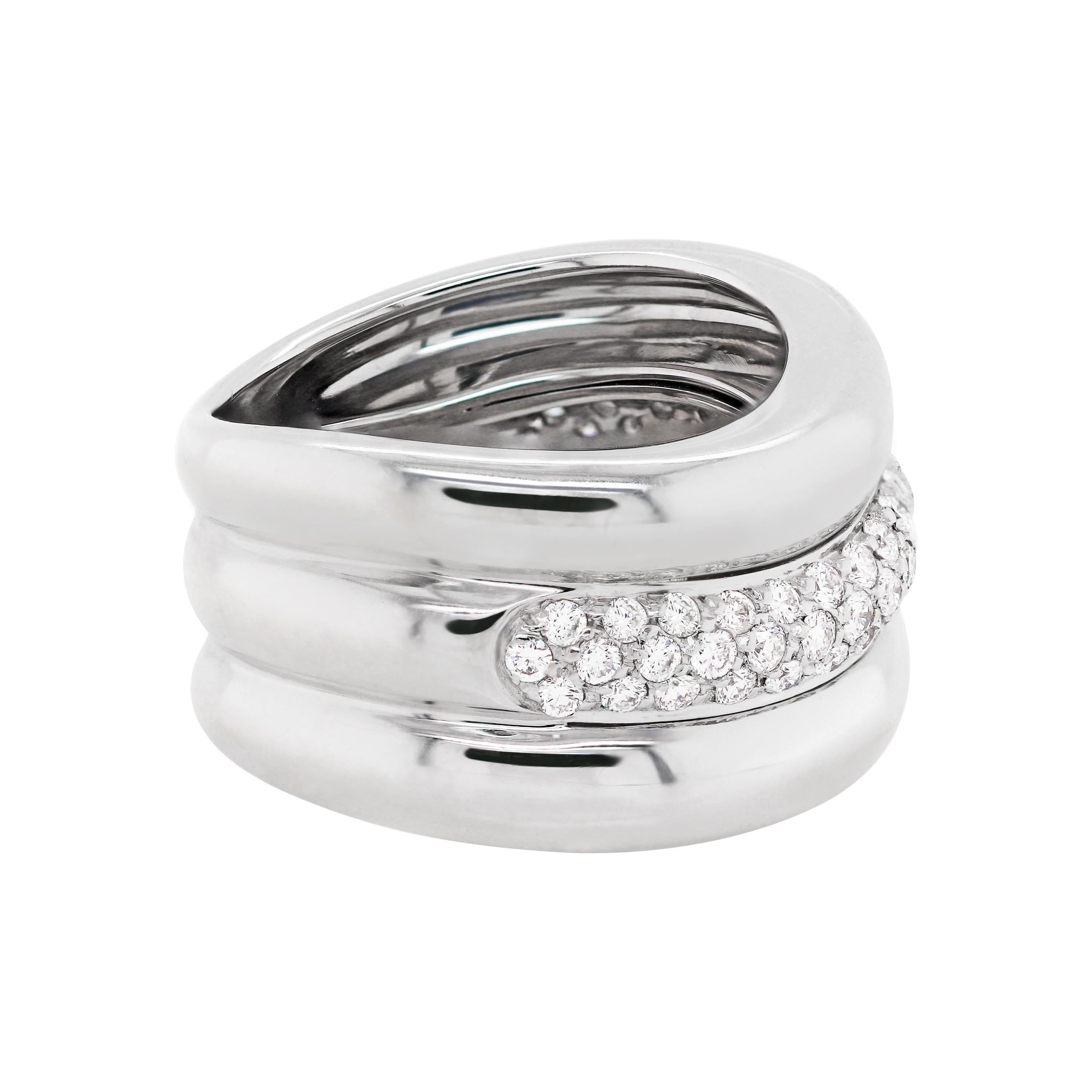 This modern waved design 18 carat white gold mount is beautifully set with a row of 55 pavé set round brilliant cut diamonds totalling to approximately 0.60ct. The band weighs 10.67gr and measures 11.5mm in width. Hallmarked 750. UK finger size 'I