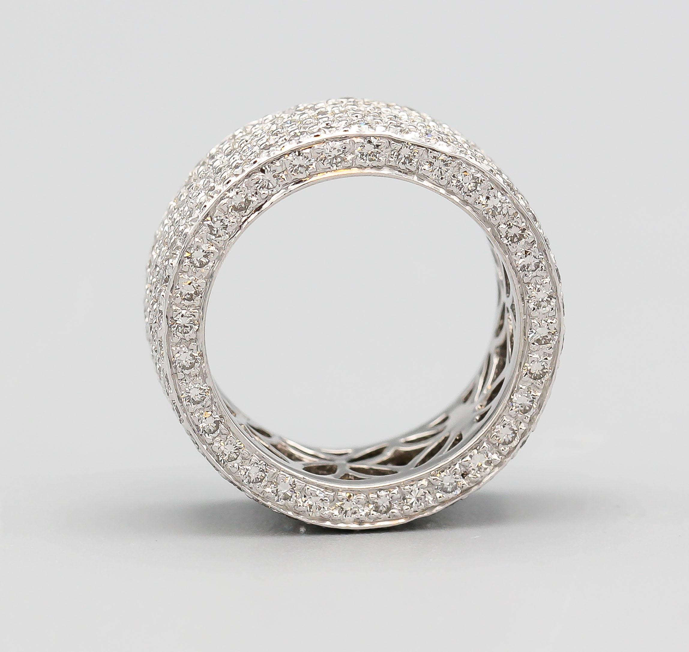 Fine diamond and 18k white gold band.  Features approx. 4.30 carats of round brilliant cut diamonds of approx. G-H color and VS approx. clarity. Size 6.25 and approx. 9 mm wide.

Hallmarks: K18, D 4.30

