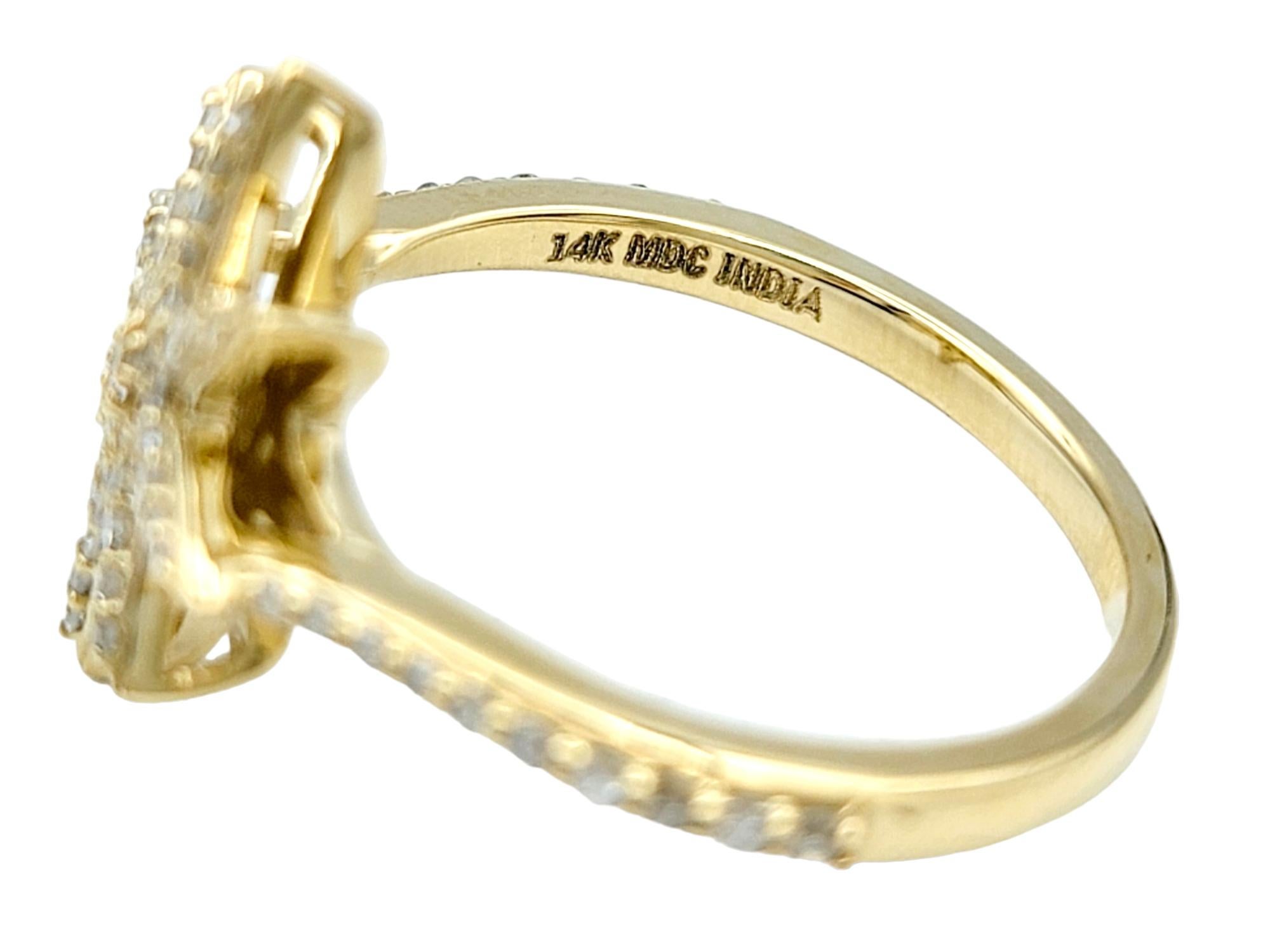 Contemporary Pavé Diamond 8-Point Star Motif Band Ring in Polished 14 Karat Yellow Gold For Sale