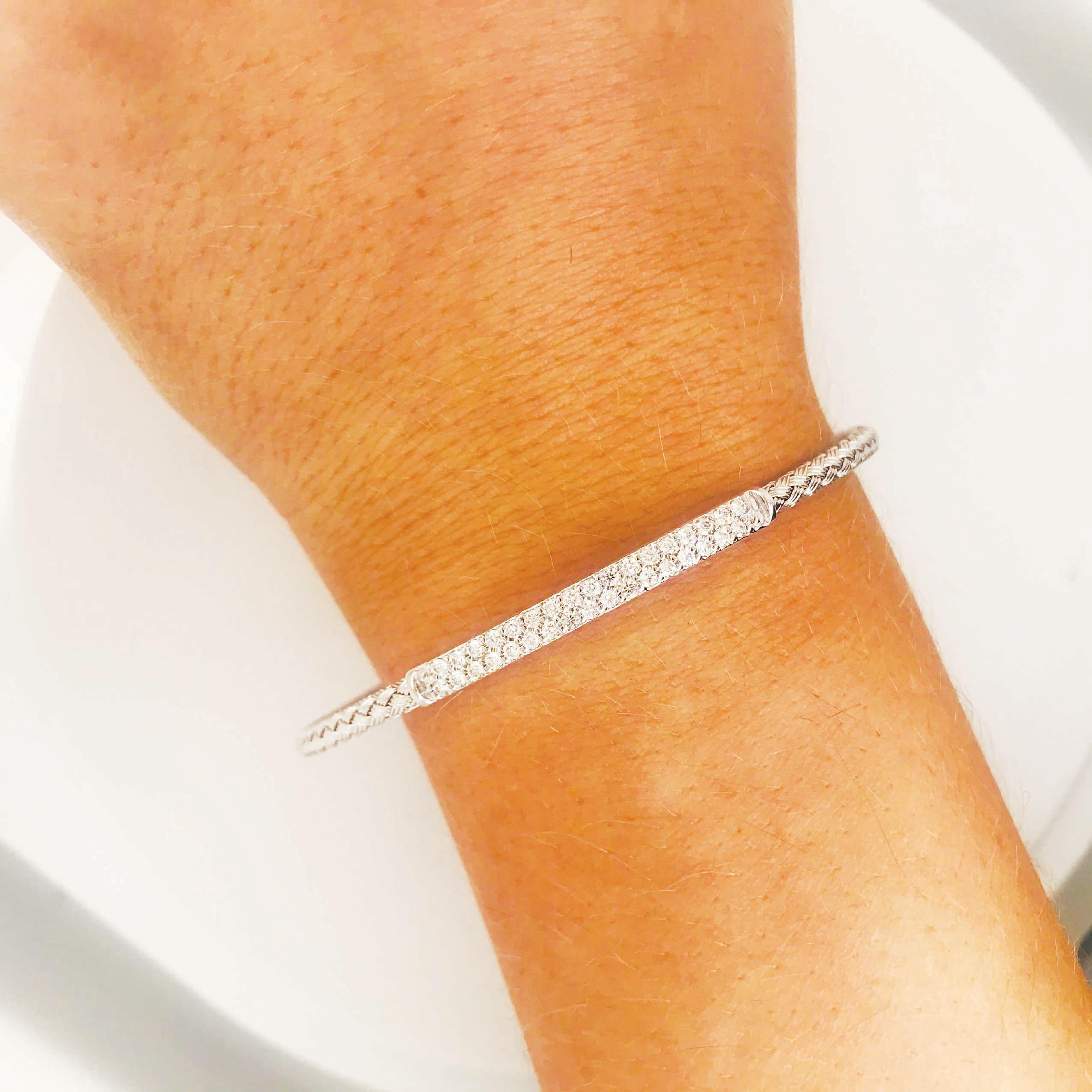 Diamond pave bar bracelet with unique flexible design! This bracelet has 34 round brilliant diamonds that sparkle beautifully in every setting. The bracelet is a cuff with an open back that sits perfectly on any arm. The bracelet has a woven design