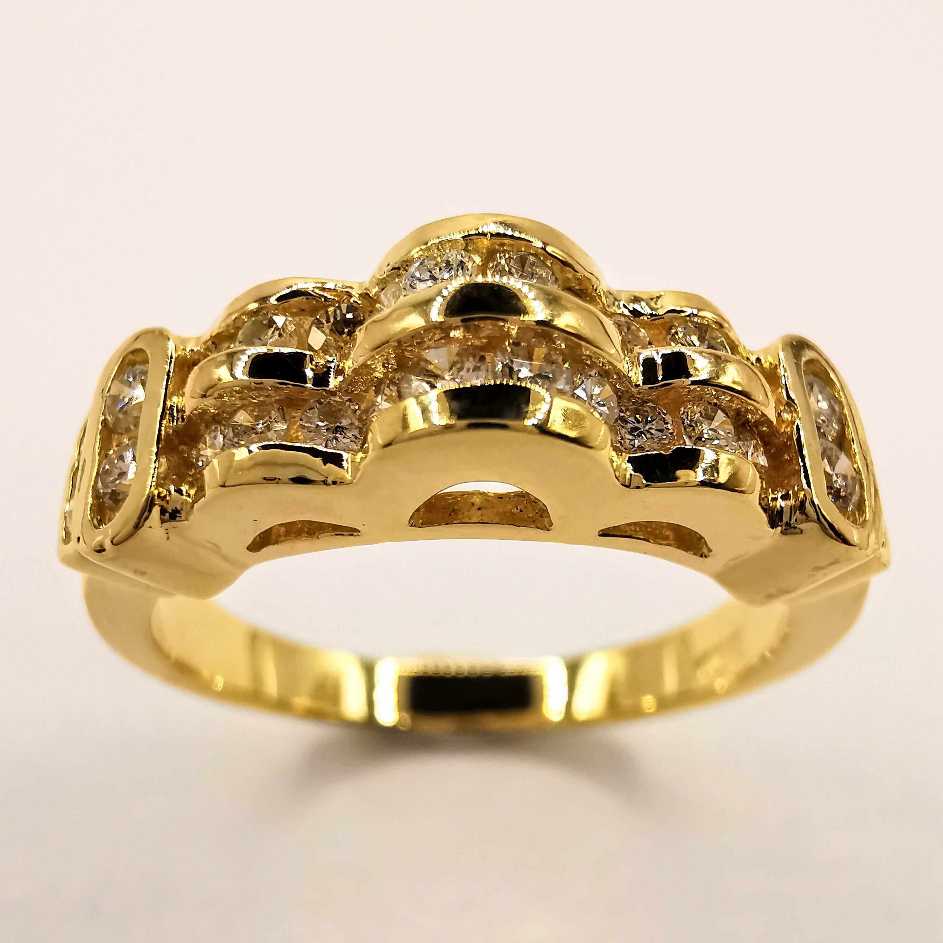 This bold and sparkly channel set diamond bridal/wedding/unisex ring is made of 850 yellow gold, which has a gold purity slightly above 20k. The ring is set with 28 brilliant cut diamonds, totaling 0.52 carats, and has a total weight of 4.8 grams.