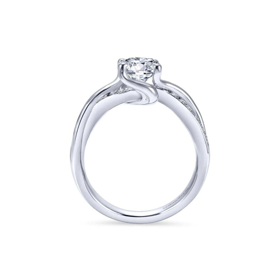 Ladies' 14k White Gold Diamond  Engagement Mounting﻿. Diamond pave weaves into the ring's shank and extends to the sides of the center stone to give this one of a kind ring a romantic appeal. Center diamond NOT included. Side diamonds 0.15 ctw, H
