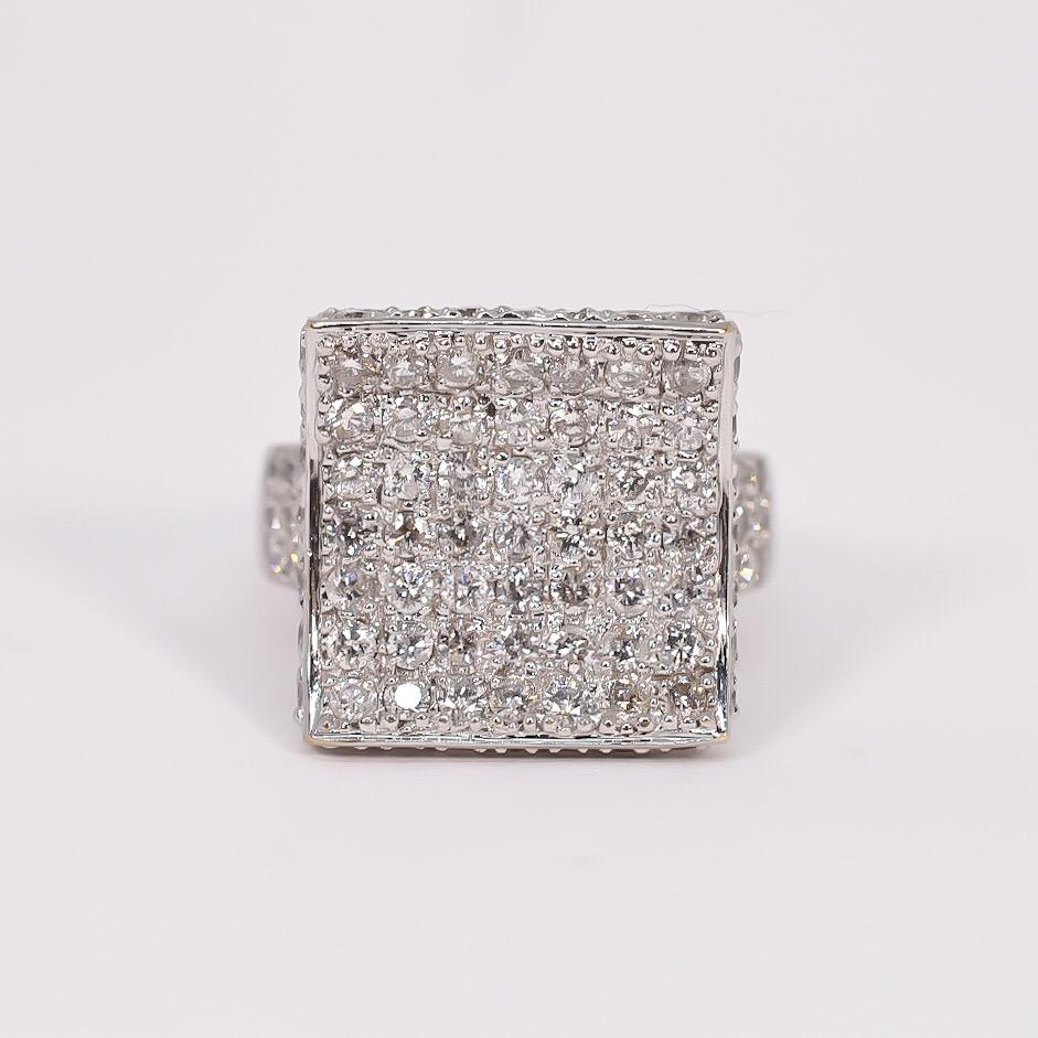 Lovely large lady's diamond pave fashion right hand ring. Designed in 18 karat white gold and set with round brilliant cut diamonds. The ring features a unique square concave top with a saddle motif. Diamonds are pave set on the saddle, saddle sides