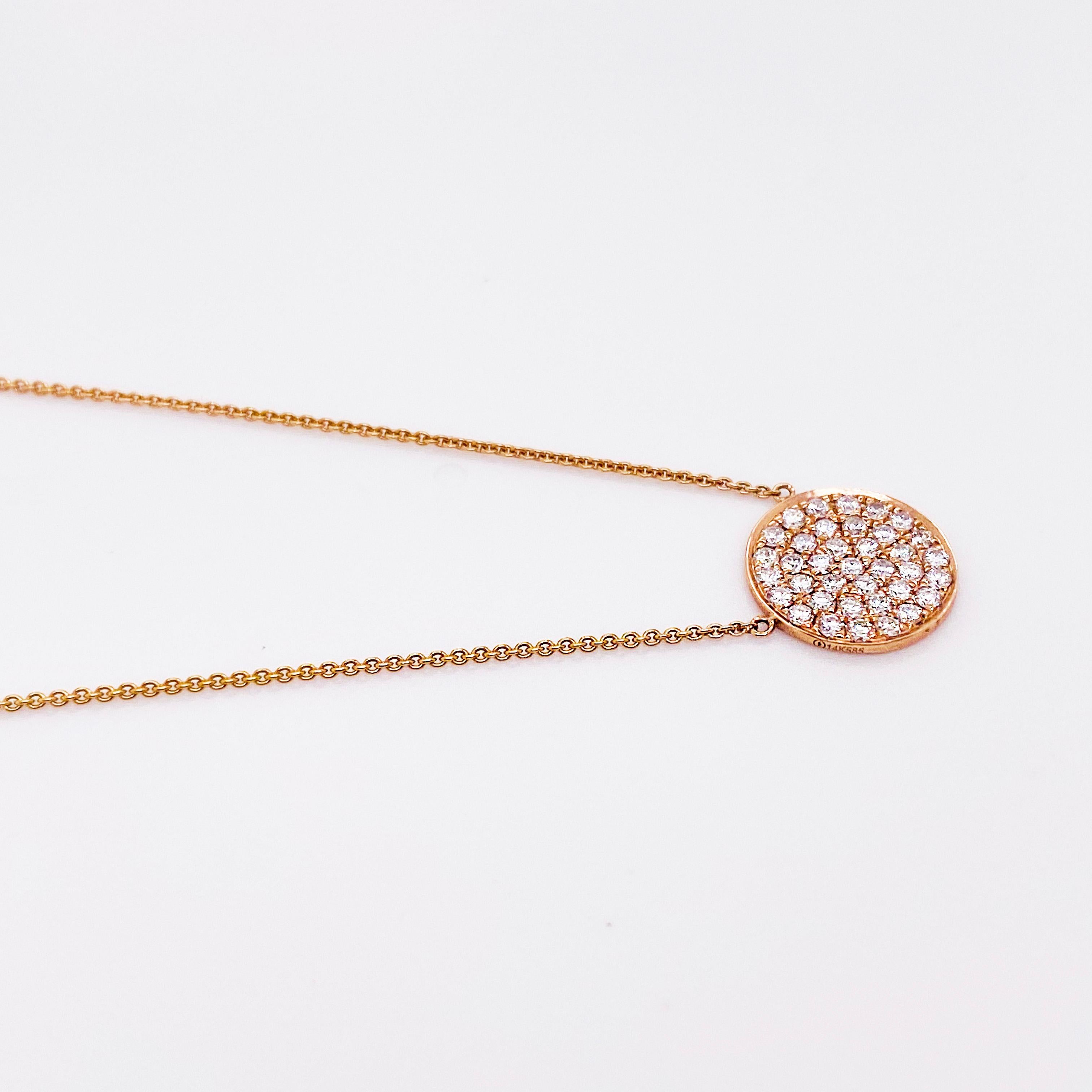 Diamond pave disk necklace that compliments every outfit! The rose gold diamond disk necklace has a 14 karat rose gold disk with round brilliant diamonds pave set, covering the top of the disk. The diamonds are amazing quality, G-H color and VS-2