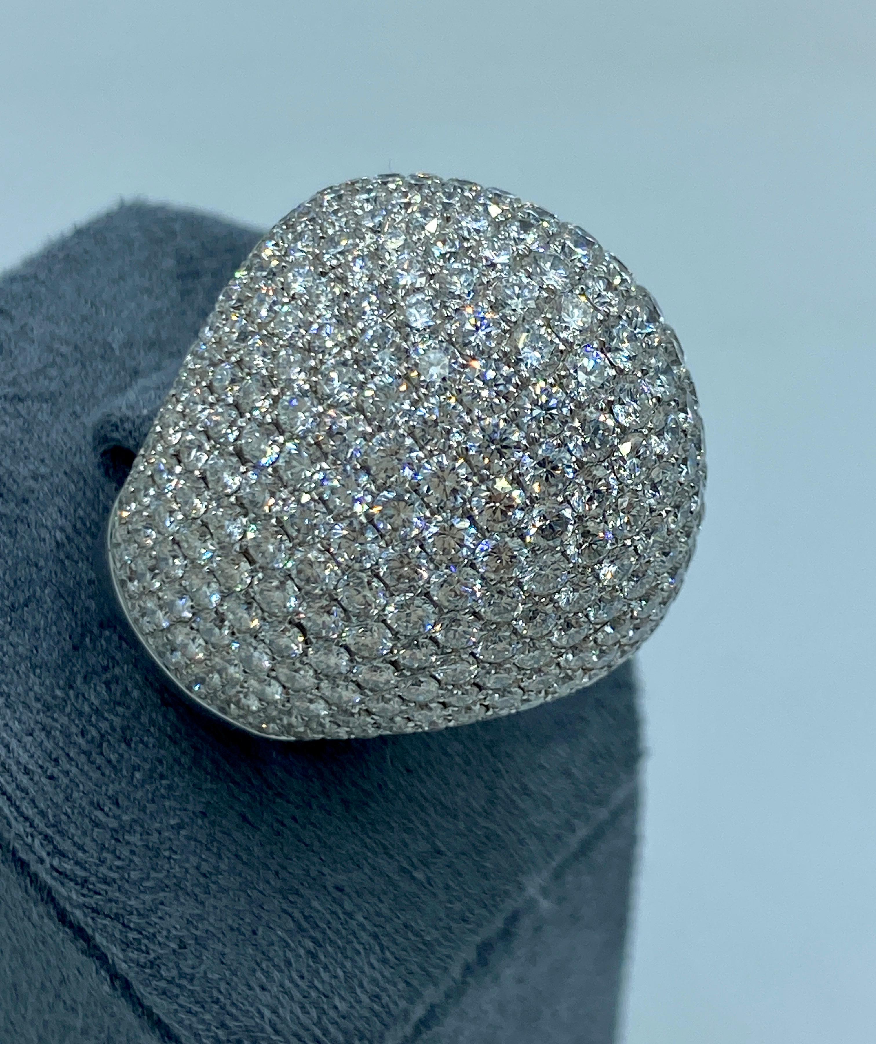 This striking pave diamond cocktail ring contains 331 round cut diamonds varying in size from 1.1-2.05 mm totalling approximately 4.6 carats. The diamonds are E-F colour and VVS clarity. It is a truly beautiful piece.