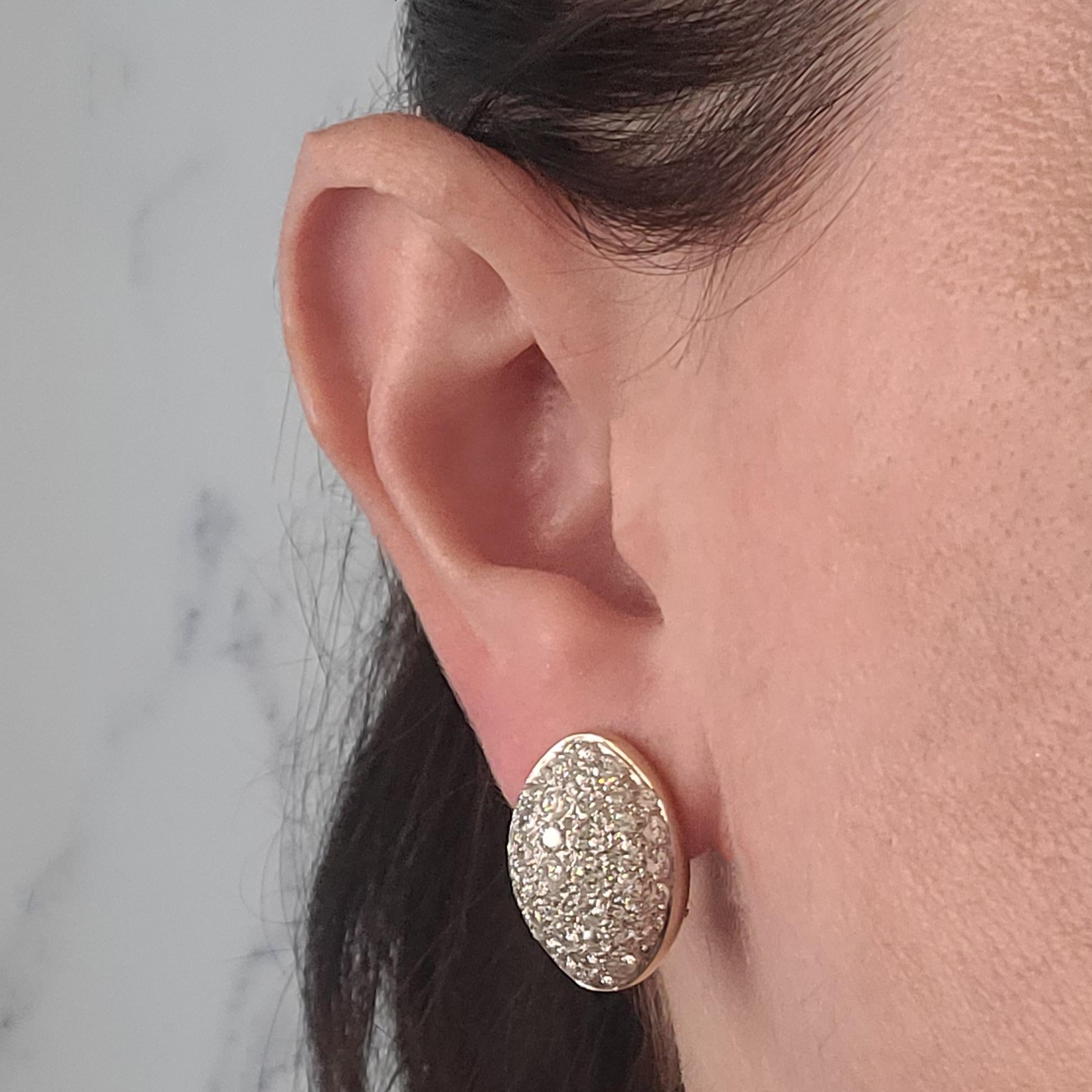 18 Karat Yellow Gold Domed Earrings Featuring 80 Round Brilliant Cut Pave Set Diamonds Of VS Clarity & G/H Color Totaling Approximately 5.00 Carats. 14 Karat Yellow Gold Omega Clip Backs With Pierced Post; Post Removed Upon Request. Finished Weight