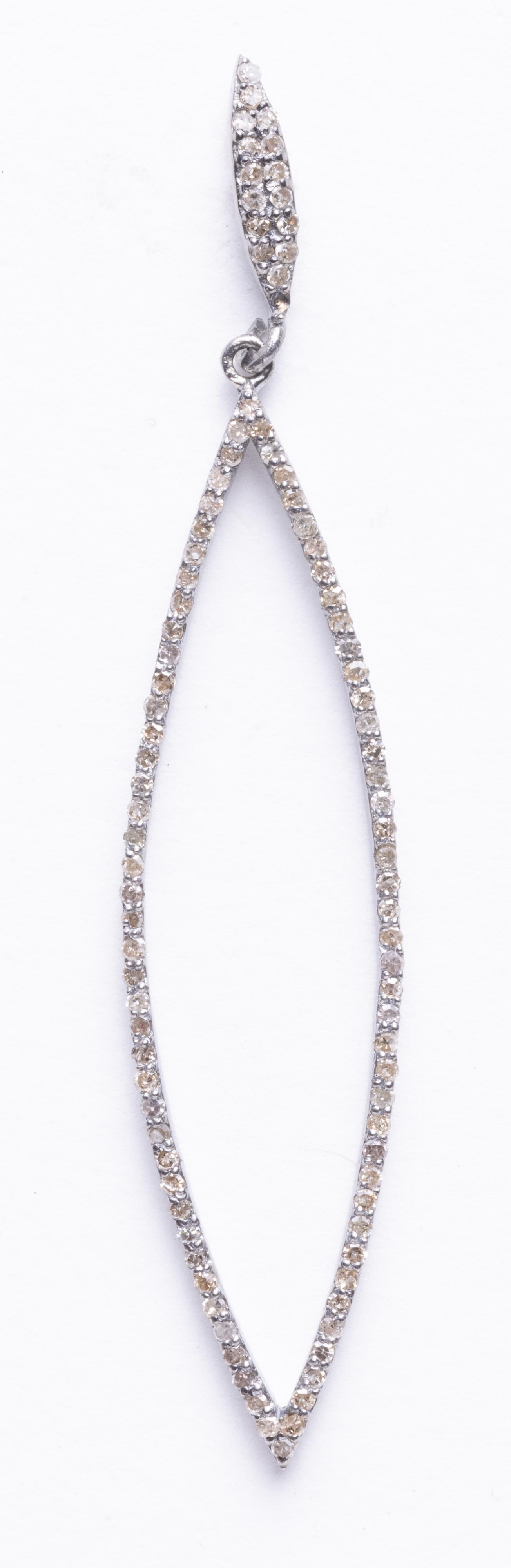 A pair of marquise-shaped drop earrings with pave'-set, round brilliant cut diamonds.  Set in sterling silver with 18K gold post for pierced ears.  Carat weight of diamonds totals 1.19.