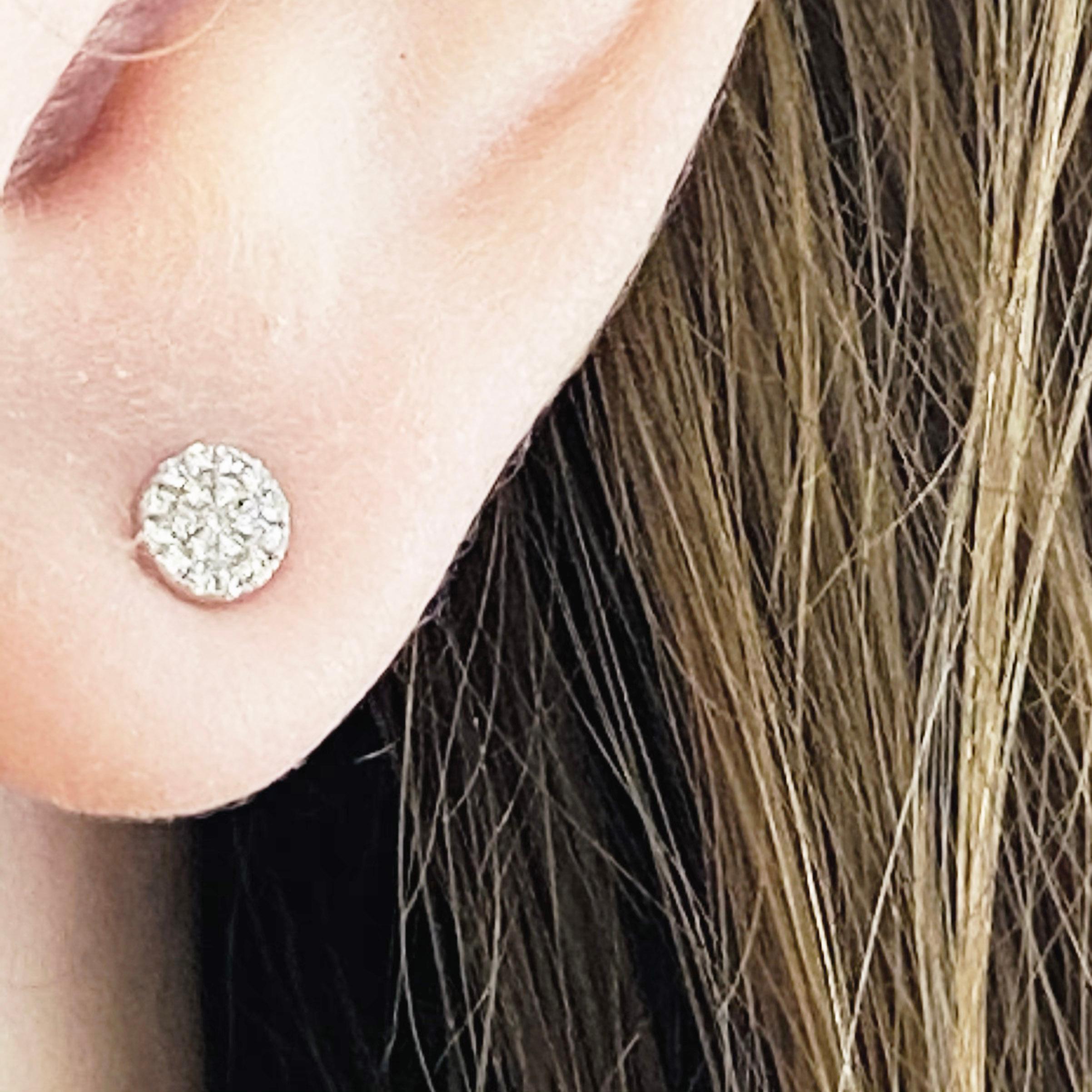 These stunning 14k white gold round pave diamond stud earrings provide a look that is both trendy and classic. These diamond earrings are a great staple to add to your collection, and can be worn with both casual and formal wear.  These earrings