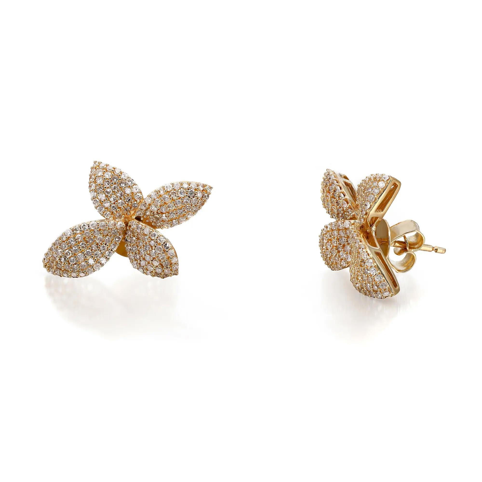 Diamonds in full bloom. These stunning diamond flower stud earrings are crafted in 14K yellow gold. Showcases pave set round brilliant cut diamonds weighing 1.00 carats. Diamond quality: color I and clarity SI. Earring size: 16.4mm x 22mm. Total