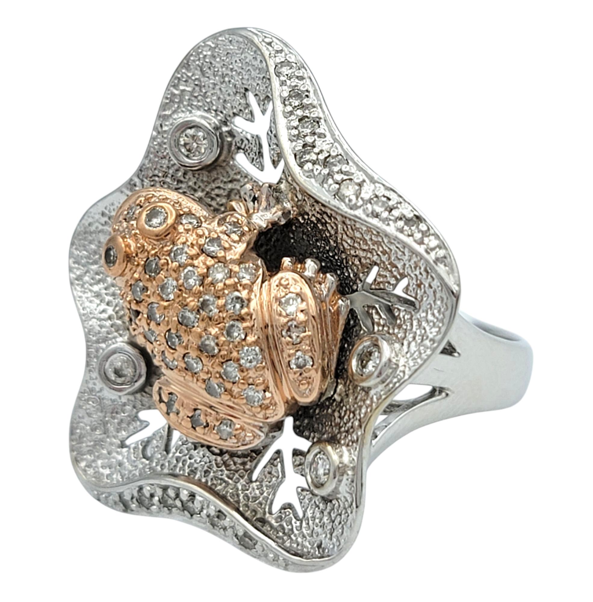 Ring Size: 7.25

A whimsical and enchanting creation, this diamond frog ring is a playful yet elegant statement piece. Crafted in a unique 14 karat white and rose gold design, this ring captures the beauty of nature with a charming frog motif