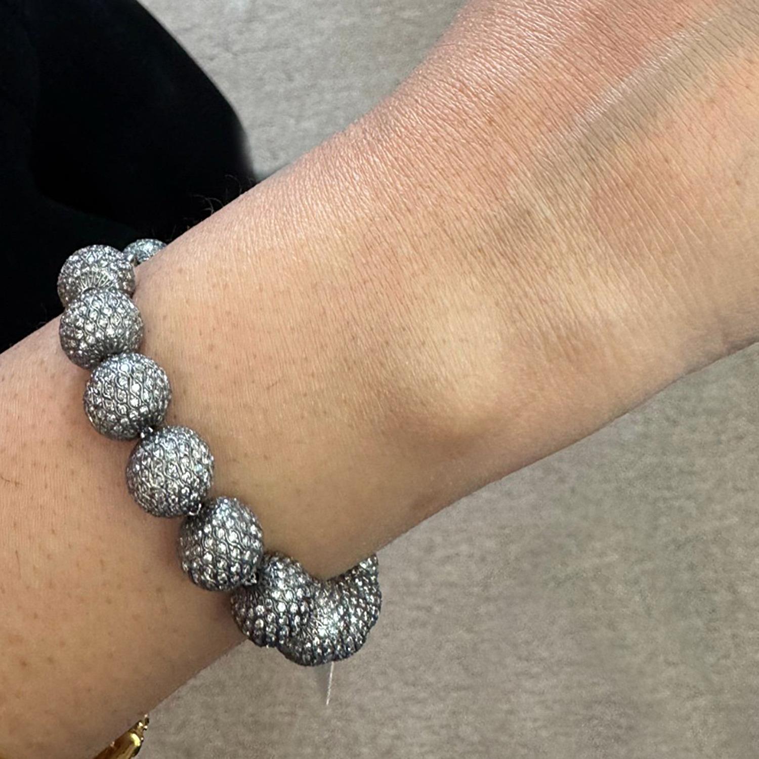 Designer Tennis Champagne Diamond Ball Bracelet is an excellent piece to match any of your black outfit. It is 7.25 inch long but the size can be adjusted if requested. The diamond balls are 10mm in size passing through 14K white gold chain with