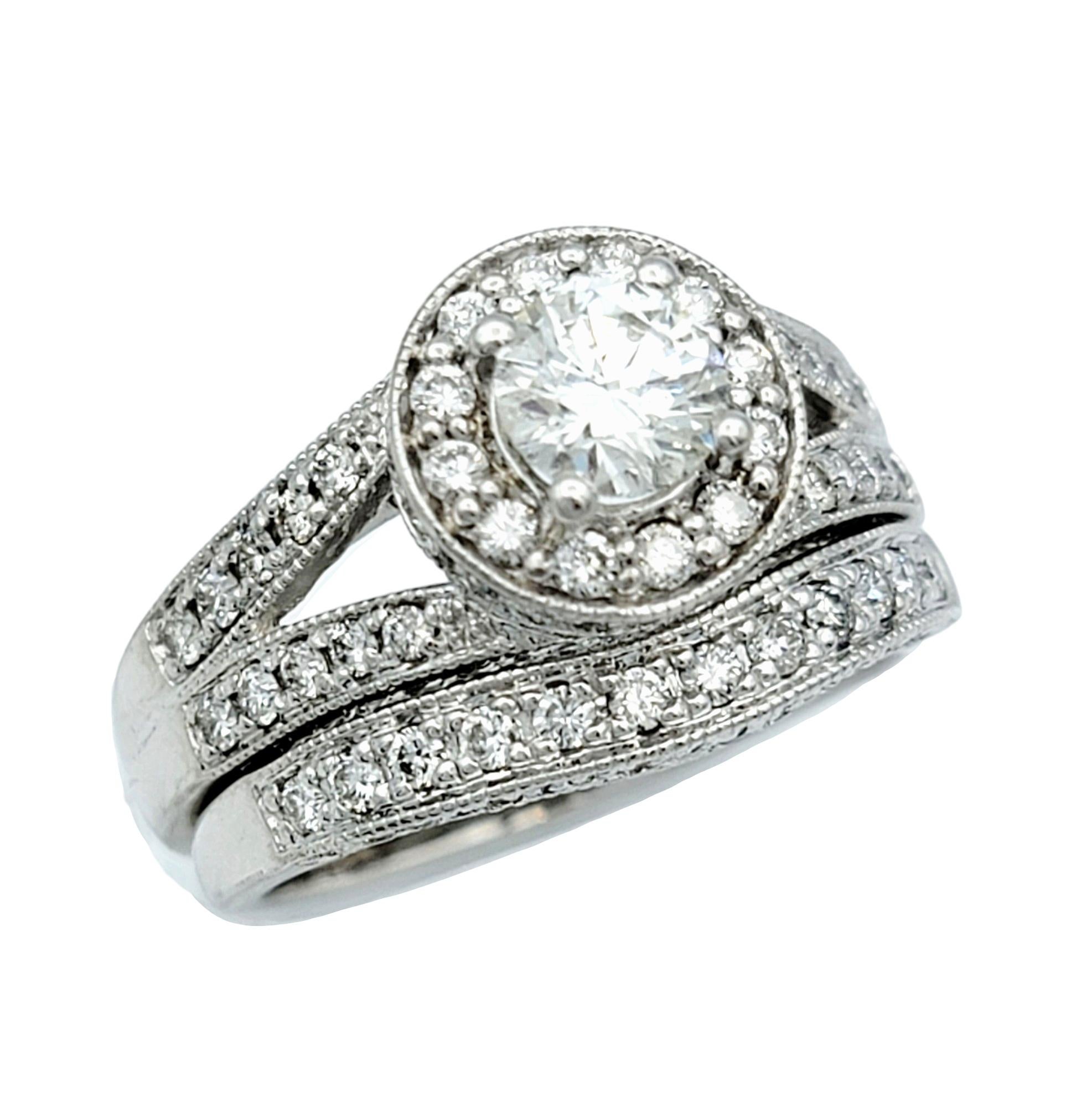 Ring Size: 7

This breathtaking round diamond engagement ring and wedding band set, crafted in elegant 14 karat white gold, is a stunning symbol of eternal love and commitment. At the heart of the main ring shines a .59 carat round brilliant
